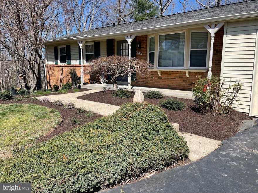 Fully Renovated, Open Concept Ranch with Hardwood floors throughout.   White Shaker kitchen cabinets with all new Stainless Steel appliances and Quartz countertops.   Premium Features include custom tile backsplash, Built-in Beverage Fridge, drawer style microwave, Over range hood, tile showers, new vanities, Rain shower heads, and frameless glass shower doors.  New  Double French door walks out to expansive (16x21' Screened in Porch - 2022) and  brand new deck w/ staircase to private backyard, which backs to woods and trails down to the Occoquan River.  New Radon Mitigation system.  New Profesional landscaping. New Washer and Dryer, HVAC, Roof, Electrical Panel, Water heater, and windows are all fewer than five years old.