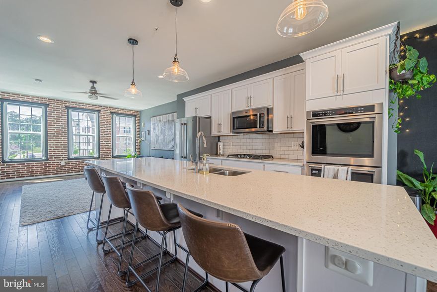 Ready to move? Take advantage of the best-valued townhomes in the DMV at Westphalia Town Center! This contemporary 3 level townhome with an open floor plan with luxury features that include upgraded Cabinetry, Granite, Hardwood, Stainless Steel Appliances, Ceramic Baths, Composite Deck, 2 Car Garage, Owners suite bathroom, 5 rooms are upgraded with Ethernet internet connections and so much more. You'll love the exposed brick accent wall and built-in fireplace.  Join Us Saturday for our Open House at 11 am - 3 pm for a look at this beautiful property.