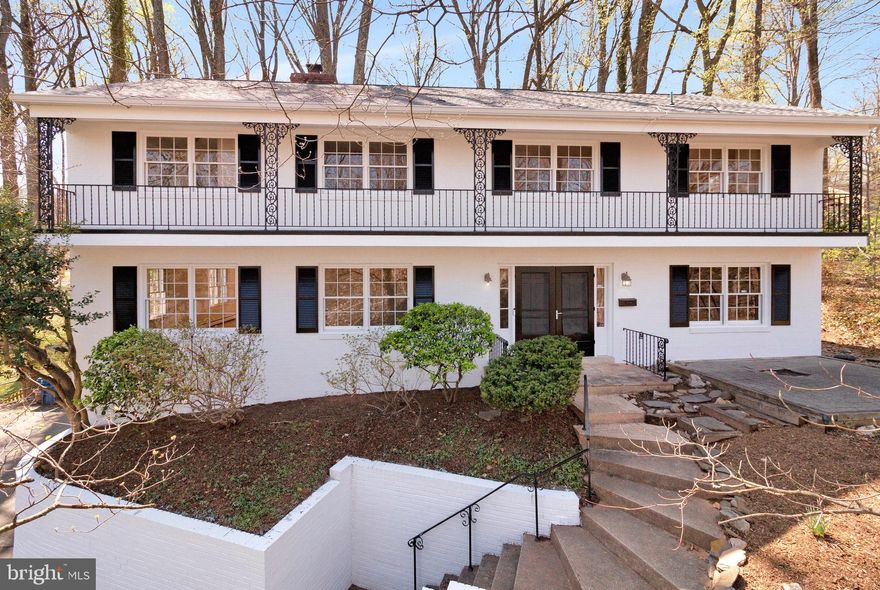 Introducing 6427 Lakeview Dr, Falls Church, VA—an exceptional opportunity to experience lake living in the sought-after Lake Barcroft community. Spanning approximately 4,000 square feet on a picturesque 1/3-acre lot, this beautiful 3-level colonial offers embassy-sized rooms and a prime location directly across from Lake Barcroft’s Beach #2, and serene lake views.  The home is surrounded by mature trees and rolling banks of ivy. The main level is designed for both comfort and entertaining. The spacious living room, with its wood-burning brick fireplace and large windows, invites in natural light and scenic views of mature trees. The formal dining room features a charming bay window, adding an elegant touch. The eat-in kitchen, appointed with rich cherry cabinetry and granite countertops, flows seamlessly into the inviting family room, where a second wood-burning fireplace creates a warm and welcoming ambiance. From here, step out to the patio and screened porch, perfect for effortless indoor-outdoor entertaining. A private study completes this level, offering a quiet retreat for work or relaxation. The upper level boasts four generously sized bedrooms, all with hardwood floors. The expansive primary suite is a standout, offering ample closet space, a dedicated dressing area, and an ensuite bath—exceptionally spacious for a home of its era. Three additional bedrooms and a well-designed second and third bath configuration provide both comfort and functionality. The lower level offers even more living space, featuring a large recreation room with a third wood-burning fireplace and brand-new carpeting. A storm shelter presents a unique opportunity for conversion into a custom wine cellar, catering to wine enthusiasts. Completing this level is the 2-car garage with direct entry into the home for added convenience. This is a rare opportunity to own a move-in ready or rennovate as you see fit home that combines incredible space, timeless charm, and unparalleled access to Lake Barcroft.