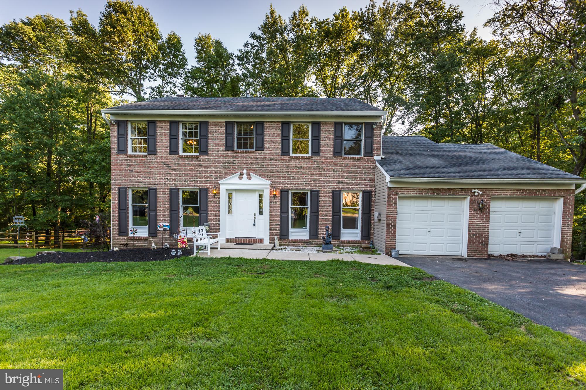 Seller is offering this 4 to 6 Bedroom 2.5 Bathroom single with plenty of living space that backs up to a wooded lot with a stream. As you approach the home notice the well-maintained brick exterior, 2 car attached garage and private driveway, so you never have to worry about parking again. Home features updated kitchen (5 years young), Newer Heater & Central A/c (May, 2019), two tier back deck, neutral décor, and plenty of natural lightening. As you enter the front door notice the gleaming hardwood flooring in the foyer and the warm, bright airy feeling this home provides. To your left you will find the Living Room and to your right you will find the formal Dining Room with crown molding and chair rail which is perfect for entertaining. 1st floor also has a Family Room which features a gas fireplace for those cool fall and winter nights. The large updated Kitchen with island has plenty of cabinet space, stainless steel appliances, dual ovens, 5 burner stovetop, double sink (plus island has an additional sink), skylight, garbage disposal and access to double tiered deck. It will truly delight the chef in the family. 1st floor also has powder room, full laundry room and access to garage for added convenience. The 2nd floor features a huge Master Bedroom with ceiling fan and Master Bathroom with soaking tub, stall shower and Skylight. 2nd floor also has 3 additional nice size Bedrooms all with ceiling fans and Full Hall Bathroom. The Full Finished Basement is one of the features that really sets this home apart from the rest. It has 3, yes 3 total rooms for whatever additional living space your family needs. 2 of which are currently used as a 5th and 6th Bedroom. Basement also has sliders to the amazing backyard. Home is also local to major roads, Phila airport and tax-free DE shopping. Make your apt today!