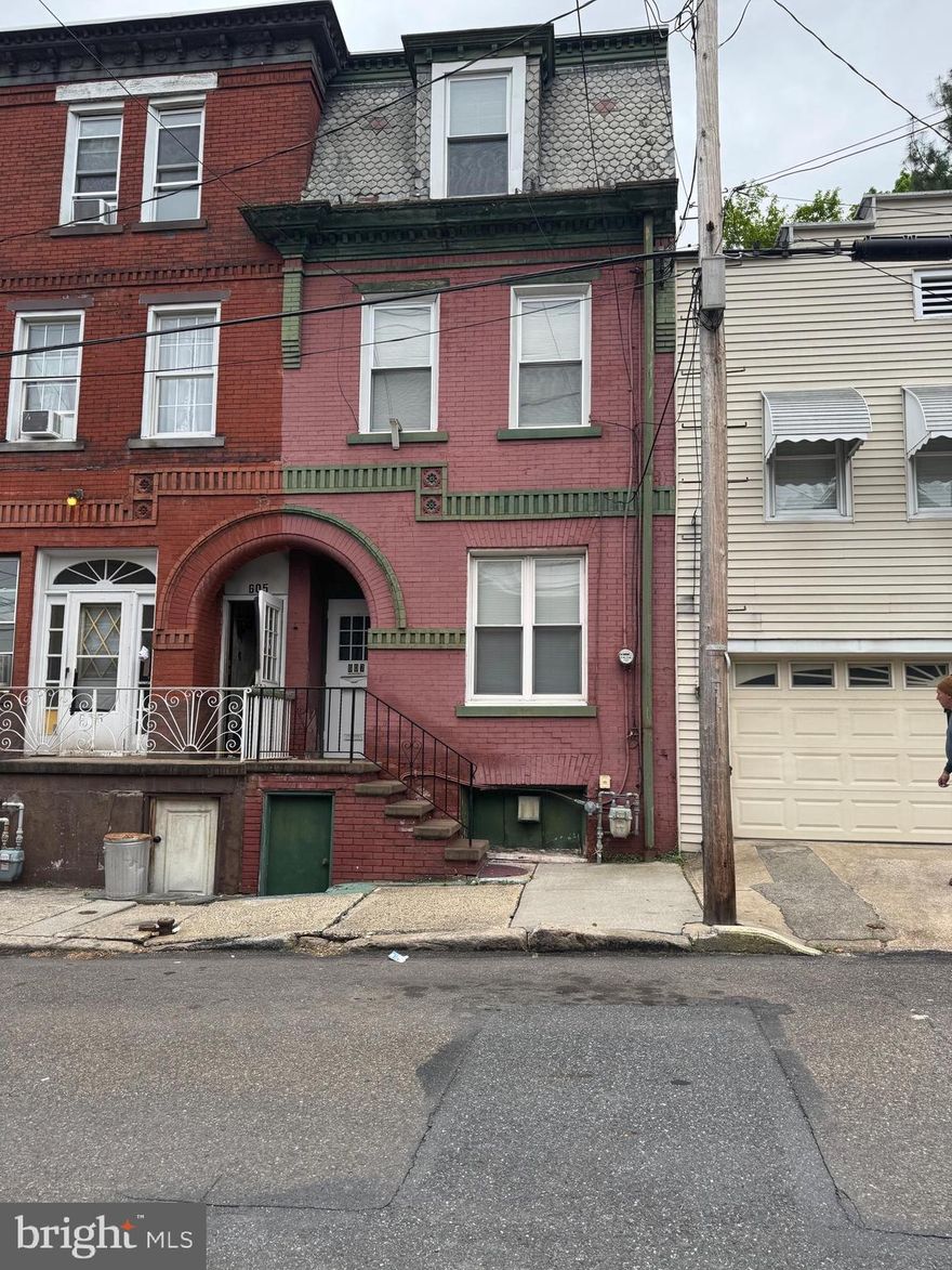OPPORTUNITY ALERT!  Investors!  This home has so much potential with 3 full bathrooms and 4 bedrooms!  2 separate entrances and off street parking.   Bring your imagination and make this home shine again!