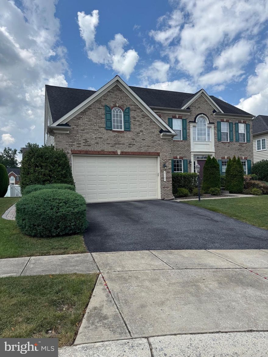 VETERANS:3.375% VA assumable $3791 total monthly payment loan amount$506,000. Sensational 3600 finished above-grade space and almost another 1700 of decadent lower-level finished space that will speak volumes to your practical and aesthetic needs. The original owner added all the extras from NV's luxury specifications and then continued to add all the bells and whistles that make this the home everyone will be wowed by! Hardwoods, recessed lights, replaced LED lighting, 12-foot ceilings on the main level, French doors to the office, custom trim, moldings, and wainscoting add to the style. Two-story ceilings in the executive-level family room are anchored by a two-story stone raised-hearth fireplace, and stylish windows open to the gourmet kitchen with espresso 42" cabinetry, Silestone counters, prep island and eat-in counters, double ovens, and a huge pantry, and the eat-in 19x12 sunroom and morning nook. Atrium doors open to a composite deck that will not mold or burn your bare feet, with a custom-covered canopy and steps to a thoughtful patio gazebo, pergola, firepit area, and walkway around gardens and to a fenced area. 
Upstairs, you will find a primary worthy of royalty with a tray ceiling painted with suede soothing decorator paint, a custom closet organizer system in a walk-in, bath having his and her sinks, a soaking tub with jets, and a separate shower accented by designer neutral porcelain tile. Upstairs you will find three other generous bedrooms, another bath, and a dramatic open hall to the family room below. In the lower level, a surprise rivals professional game rooms, with space for all your passions: a quality bar with soft closing cabinetry, granite counters, bar fridge and microwave, and built-ins, a 5th bedroom(25x16) en-suite with walk-in closet and full bath, and two additional storage rooms. 
Located in Hanover, in Anne Arundel County, you are just minutes from NSA, Fort Meade, MARC, shopping, and restaurants. Community has a pool, playground, and clubhouse on Dorchester Blvd-$500/year, FFA $500/year, which expires in 14 years, and a tax district of $2051/year included in the tax bill.
Seller is actively looking for a home of choice and would like the buyer to be flexible to accommodate the transition and dates, possibly including a rent-back. Roof to be replaced, and Sun Run 46"solar panels make for low energy bills, usually 30% less than standard.