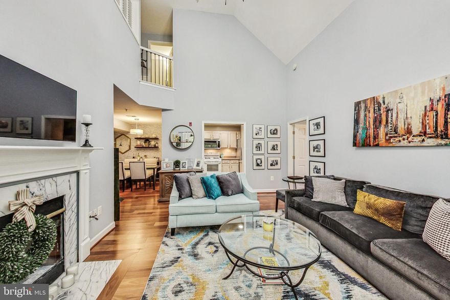 Stunning 3 Bedroom, 3 Bath Top Floor Condo with Soaring Ceilings-- This condo features vaulted ceilings, gleaming hardwood floors and a fabulous loft bedroom. Main level features a fully equipped kitchen with plenty of cabinet space, separate dining area, and family room off of the kitchen. The family room boasts beautiful soaring ceilings, a cozy fireplace with a mantel and sliding glass doors to a spacious rear balcony with views to trees and creek - perfect for relaxing nights. Two large bedrooms located on the main level both with ensuite baths and walk in closets! Upstairs loft area overlooking the family room features a spacious,  bright bedroom, full bath and a laundry and storage room with shelving. This home is in a great location - Just minutes to I-270, 355, and close to public transportation. Close proximity to Crown, Rio, and tons of shops and restaurants, Sugarloaf Mountain, parks, the Decloverly Community Pool, and so much more! Plenty of parking and storage unit space in the building corridor for tenant's use!