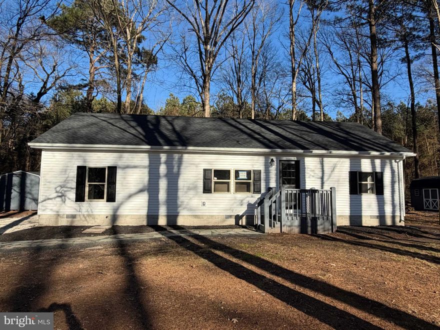 The renovations have just been completed on this very cute Class C home situated on a just over a 1/2 acre in the Woodlands of Millsboro. The natural light throughout this home is awesome! This home features a split floor plan with 3 bedrooms and 2 full baths that have just been updated, all new LVP flooring throughout and a great new kitchen with quartz counters and tile backsplash. Huge open common living areas in the middle of the home provide a very spacious feel. The bedrooms feature good closet space. Both baths have been updated. Crush stone driveway with a carport. Big storage shed in the yard. Take a look quickly, as this one will not last long!