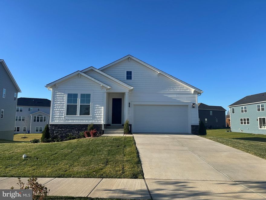 Don't Miss the Only Rambler Available for Sale and Immediate Delivery! Nestled in the one of Culpeper’s newest communities … The Greens, this gorgeous newly built rambler, completed in 2025, offers a harmonious blend of luxury and comfort across almost 3,000 sq/ft of newly custom painted finished space. With a thoughtfully designed open floor plan, this residence is perfect for both entertaining and everyday living. Step inside to discover a warm and inviting atmosphere, accentuated by luxury vinyl plank flooring that flows seamlessly throughout the main living areas. The gourmet kitchen is a chef's dream, featuring Quartz countertops, a spacious island, and top-of-the-line stainless steel appliances, including a built-in microwave, wall oven, and gas cooktop. The kitchen effortlessly transitions into a cozy family room, creating an ideal space for gatherings. A charming eat-in area invites you to enjoy morning coffee while basking in natural light. The home boasts three generously sized bedrooms, including a primary suite that serves as a private retreat. The primary bath is a sanctuary of relaxation, complete with a soaking tub and a walk-in shower, ensuring a spa-like experience at home. Each bedroom is designed with comfort in mind, featuring plush carpeting and ample closet space. The partially finished basement offers endless possibilities, with daylight windows and a walkout level that provides easy access to the outdoors. This versatile space boasts a cavernous recreation room and to-be finished areas that could be additional guest quarters, home gym, study or whatever you need, thus catering to your lifestyle needs. Additional highlights include recessed lighting throughout, a main floor laundry for convenience, and an electric fireplace that adds a touch of warmth, ambiance and a modern vibe to the living area. The home is equipped with a tankless water heater, ensuring efficiency and comfort. Outside, the property sits on a generous 0.28-acre lot, providing ample space for outdoor activities and landscaping opportunities. The attached front-entry garage accommodates two vehicles on a nearly $10,000 epoxy floor, with additional driveway space for guests. This residence is not just a home; it's a lifestyle. Experience the perfect blend of modern luxury and comfort in a community that values quality living. Embrace the opportunity to make this stunning property your own and enjoy the exclusive lifestyle it offers.