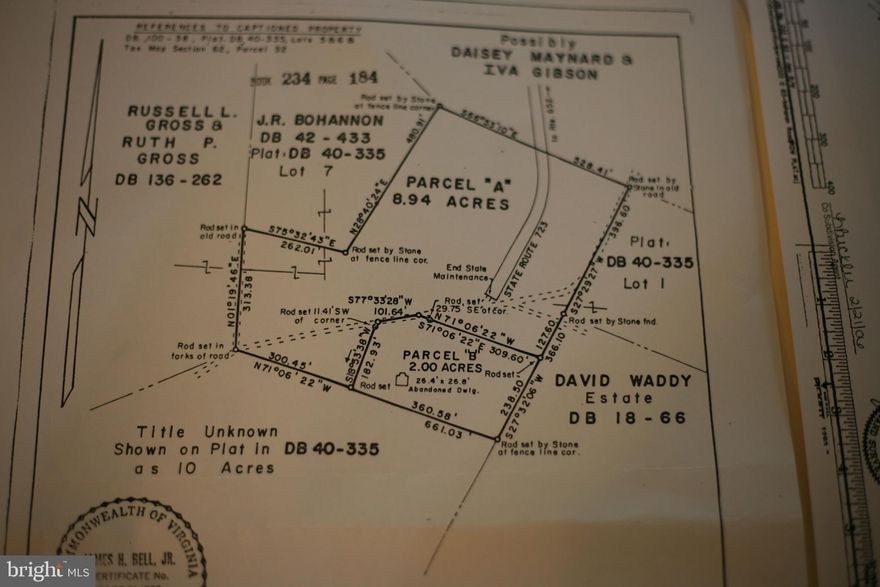 7.819-acre parcel lies on both sides of Bohannon Road shown on plat of survey as Tax Map 62-21.  Additional plat shows the 50-foot right of way conveyed to the Commonwealth of Virginia.   Wooded parcel with cleared area on the north side of Bohannon Road contains a camper and RV that will be removed prior to closing.  Note that the property lines are not flagged.  Contact the listing agent for additional information.  Valere Real Estate, Inc. sign at entrance to open area.