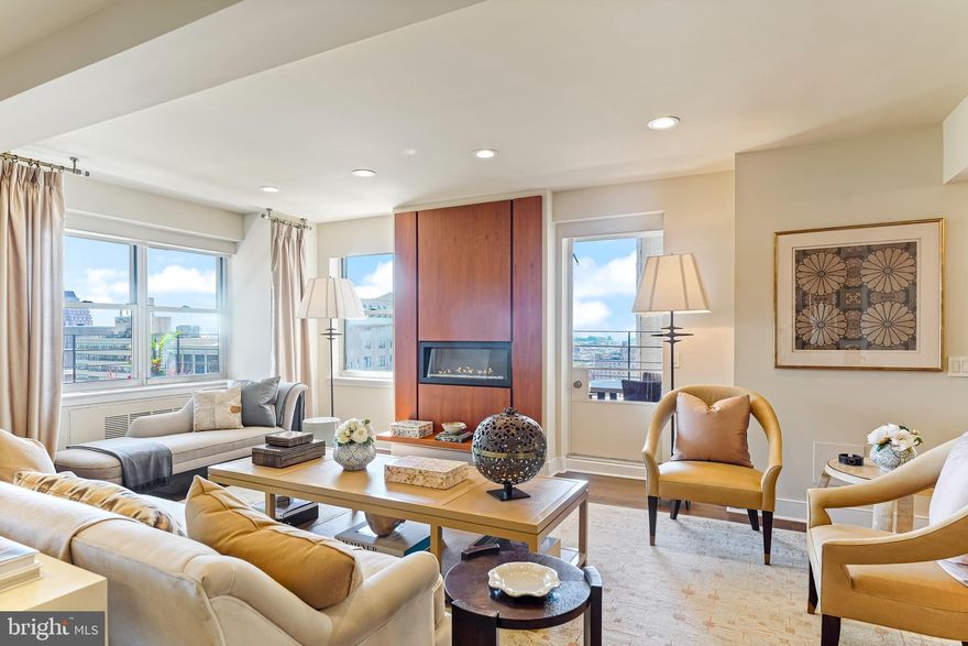 Introducing the epitome of Center City living - a beautiful residence nestled on the 21st floor of an elegant boutique condominium building. This sensational home boasts front and center views of the iconic Rittenhouse Square and the Center City skyline. Bathed in sunlight, this unit offers not just one, but TWO TERRACES that provide a perfect vantage point to soak in the stunning views. A welcoming foyer beckons you into an expansive and inviting great room. A spacious living area awaits, complete with a fireplace and a built-in bar.  Entertaining is a delight in the spacious dining area, which can easily accommodate large gatherings, making it the ideal space for entertaining or everyday living. A gourmet's dream, the open kitchen boasts cream-colored cabinetry, a spacious island with seating for four, and a custom tile backsplash. High-end stainless-steel appliances including a convection wall oven, a warming drawer, a gas cooktop, and a Sub-Zero refrigerator elevate the culinary experience. The cozy den, complete with pocket doors for privacy, offers serene park views—perfect for quiet moments or a secluded workspace. The main bedroom suite features abundant closet space and an ensuite bathroom with a double vanity, steam shower, separate water closet, and heated floors. An additional spacious bedroom and a full bathroom, laundry room and large storage closet complete this unit.  24-hour door-person building offers security and convenience. Step outside, restaurants and shops beckon you to explore the vibrant city life at your doorstep. Welcome to your exquisite new home, where luxury meets location.