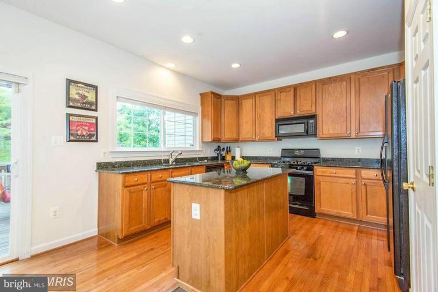 Beautiful bright townhome South County School.Nr Fort Belvoir.Large gourmet kitchen w/granite,center island,built-in microwave. Brkfast area/Fam Room with sliding door walk-out.View trees from spacious deck in fully-fenced in backyard. Hardwood main level.Large double-door MBR with walk-in closet, en-suite full bath w/separate shower.Cozy basement rec-room with 3 piece full bath.NOW BEING PAINTED