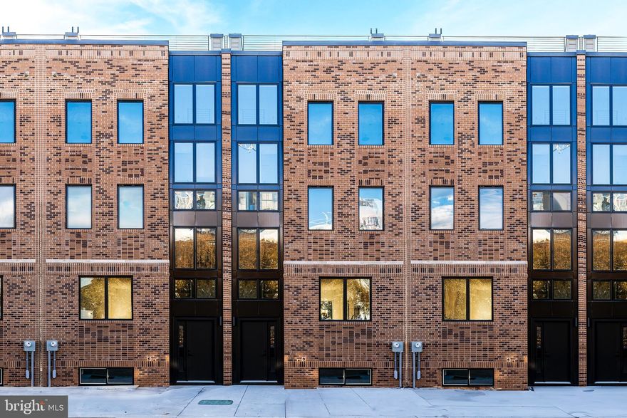 Welcome to Liberties Court, an exceptional new construction townhome development in the heart of Northern Liberties, one of Philadelphia’s most vibrant neighborhoods. This luxury home offers everything you’ve been looking for—modern design, top-tier amenities, a private elevator, 2-car garage, and unparalleled convenience. Featuring 3 spacious bedrooms, 3 full bathrooms, and 2 half bathrooms, this residence is designed with both style and comfort in mind. The ground-floor entrance welcomes you with convenience and functionality, offering direct access to your attached two-car garage via a covered driveway—a rarity in urban living. This level also includes a full bathroom and a fully finished flex space with soaring ceilings, ideal for a home office, fitness area, or guest suite. From here, step into your private elevator, which provides seamless access to every level of the home. On the main living floor, you’ll find the heart of the home: a meticulously designed kitchen outfitted with high-end Bosch appliances and a sleek Zephyr Roma series range hood. The kitchen seamlessly blends elegance and functionality, making it perfect for both everyday cooking and entertaining. Adjacent to the kitchen is a large dining room and living room, offering an open and airy space ideal for gatherings. Through the sliding glass door, enjoy easy access to a beautiful inner courtyard—perfect for relaxing or dining al fresco. A half bathroom on this level adds convenience for both residents and guests. The second floor features two spacious bedrooms and a full bathroom, each thoughtfully designed with large closets providing ample storage for a seamless living experience. This level also features a spacious laundry room for added convenience. The primary bedroom floor serves as your private retreat, complete with a large walk-in closet and a spa-like en suite bathroom with double vanities, a soaking tub, and a glass-enclosed shower—your perfect sanctuary at the end of the day. Throughout the home, thoughtful details elevate the living experience, from the private elevator to the top-floor entertaining lounge, tailored for comfort and social gatherings. This level features a wet bar, a half bathroom, and access to two outdoor spaces. Step through sliding glass doors onto a private terrace, ideal for intimate get-togethers, or take the stairs to the expansive roof deck boasting unobstructed 360-degree views of the Philadelphia skyline—a breathtaking backdrop for larger events or quiet evenings under the stars. With three outdoor spaces, including the peaceful courtyard, this home offers abundant options for relaxation and entertaining. Situated in dynamic Northern Liberties, Liberties Court places you moments from the city’s best restaurants, cafes, and boutique shops, as well as local favorites like The Piazza and North Bowl. For commuters, quick access to I-95 and the Market-Frankford Line ensures seamless travel to Center City and beyond. Homes in Liberties Court offer a rare combination of luxury, practicality, and location. *4-bedroom layout also available*