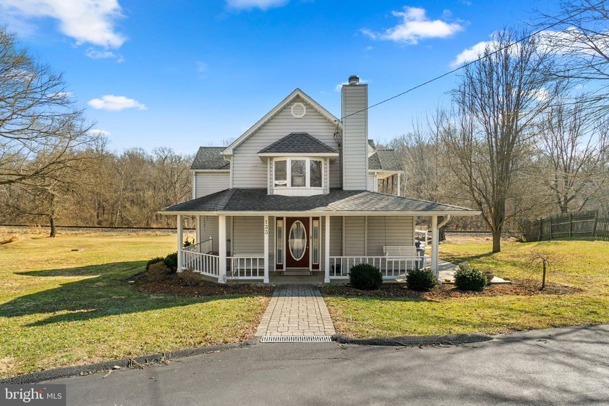 Situated at the end of a private road, this charming and character-filled home exudes timeless appeal while offering modern updates throughout. As you approach, the inviting front porch sets the tone for what’s inside. Step into the spacious main living area, featuring a premium pellet stove, luxurious flooring, and ample space perfect for relaxation and gatherings. The updated kitchen equipped with granite countertops, beautiful hardwood floors and granite countertops is both functional and stylish, making it a true focal point of the home. With 4 bedrooms, including a serene owner’s suite with its own private balcony overlooking the woods, this home offers comfort and tranquility. Two full bathrooms add to the convenience. The home is equipped with modern essentials, including a new whole-house filtration system with UV light, a 2024 water heater, and a newer holding tank. Sitting on over an acre of land, there’s so much potential for outdoor activities, gardening, or even expanding the space. The large parking area and detached garage with a carport are great for storage or keeping vehicles out of the elements. The back deck is an amazing spot to relax and take in nature – especially with the wildlife around! The outbuilding is a nice bonus, especially with a pellet stove and air conditioning. It could be perfect for a workshop, art studio. Surrounded by nature, privacy, and charm, this property provides the perfect balance of modern comforts and rustic appeal. It’s not just a home—it’s a lifestyle waiting for you to make it your own.