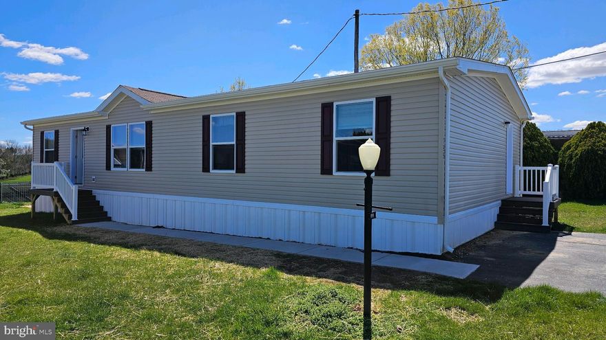 Do Not miss this 3 BR 2 full bath newly constructed double wide home in spring grove school district In Country Side Community. Features of this home are a large living room, Beautiful kitchen with island,  stainless steel appliances and spacious dining area. The master bedroom has a master bath with double sinks and walk in closet. Additional 2nd bedroom & bonus 3rd bedroom / office space and 2nd full bath all on the main floor. This brand new home with all new appliances can be yours, schedule your showing today!
Concrete sidewalks will be  poured from the front steps to the driveway  and  some grading  done on the lot.