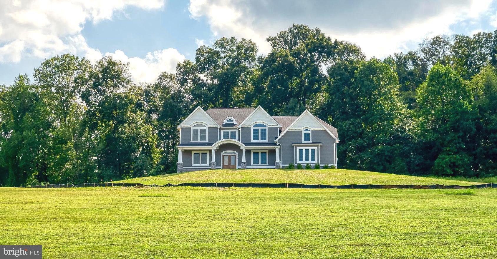 NEW CONSTRUCTION HOME AVAILABLE FOR JUNE DELIVERY on Beautiful 10 acre homesite with Panoramic Views ! Greenspring Homes Adams 3 Nantucket Model with designer selected luxury upgrades throughout ! DON'T MISS THE MAY SAVINGS EVENT ! Choose $ 20,000 in FREE OPTIONS or $ 10,000 CASH at Closing or 2/1 Interest Rate Buydown (Builder will pay to buy your rate down 2% first year & 1% second year) - (see flier)***. Gourmet A "Chefs Dream" Kitchen with all the perks including large Walk-in Pantry. Spacious Breakfast Room w/triple slider, Mudroom with custom built-ins, Family-Great Room w/ Box Coffered Ceiling & Gas FP. Formal Dining Room, Main Floor Office & Full Bath. Grand Main Staircase & 2nd convenient rear Staircase. Owners Suite w Luxury Bath w/2 Person WI Shower, Freestanding Soaking Tub & 2 Walk-in Closets. Convenient 2nd Floor Laundry & 4 additional Bedrooms w/upgraded baths. 3 Car Oversized side load garage with expanded parking pad & more ! There's still time to add finished rec room, theatre/fitness room, covered /screened rear porch or first floor in-law suite. (Home is under construction - Video tours of the model available to see. Note: Photos in Listing are of a similar model home. This home is still under construction.)