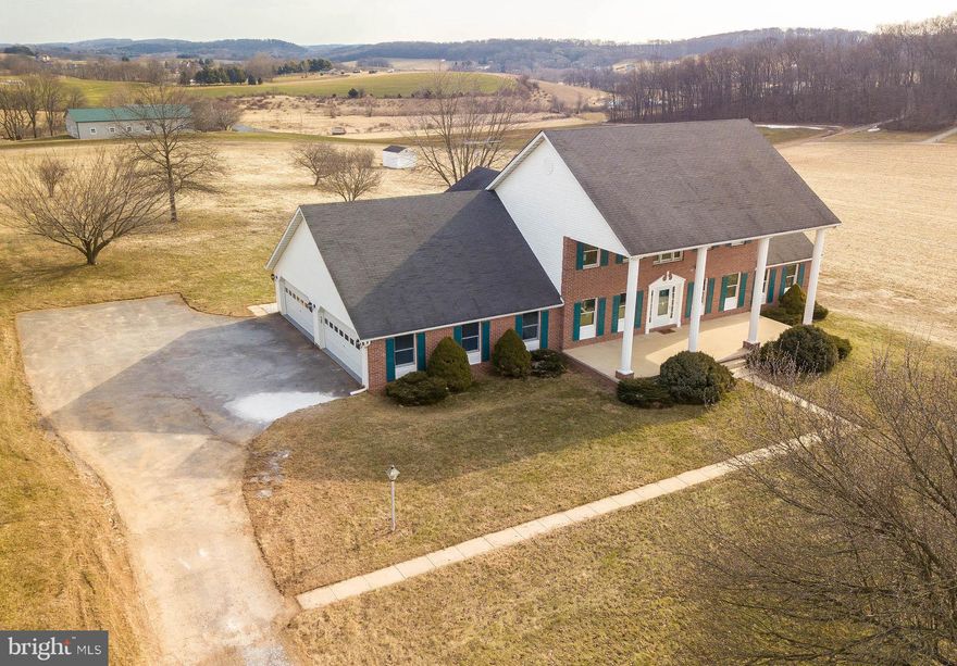 YOU HAVE TO SEE THIS ONE!! Over 4000 square feet of living space and situated on 3.3 acres....surrounded by pastures. The 2 story foyer welcomes you with it's stately feel. Main level has gleaming hardwood throughout. Large open kitchen with stainless steel appliances, formal dining room, living room, and family room. Upper level boats a spacious master suite with lux bath and a private balcony. Lower level is perfect for an in law suite or rental with a bedroom, living room, and full kitchen. Features a 4 car garage, large patio, and level yard. This house has so much to offer....it will sell itself, just open the door! SEE AGENT REMARKS FOR OFFER INSTRUCTIONS