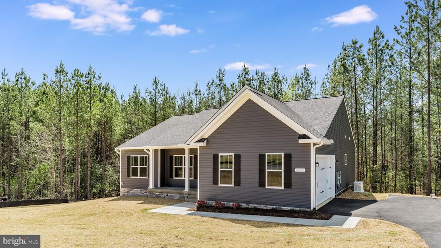 Welcome to the stunning Clayton model by Foundation Homes, a sophisticated and functional craftsman-style home that offers ample space for entertaining, available early to mid July. This exceptional home features a fully finished lower level with an impressive 9-foot ceiling height and exquisite craftsman finishes throughout, creating the perfect environment for family and friends to gather.   As you enter from the inviting craftsman-style front porch, you'll be greeted by an open concept family room boasting soaring cathedral ceilings, an electric fireplace with a shiplap wall and mantle for immediate ambiance, and luxury vinyl plank flooring throughout the main floor.   The well-appointed kitchen showcases craftsman finishes and comes complete with solid wood shaker-style white cabinets, stainless steel appliances including a wall oven, built-in microwave, cooktop range, large under-mount stainless sink, and granite countertops, making cooking an absolute pleasure.   Step outside onto the composite back deck and take in the beautiful backyard views and fresh air. The spacious master suite offers a generous walk-in closet, dual vanities, and an upgraded shower layout. A separate mudroom and laundry room provide the ideal space for shoes, backpacks, and coats.   Hidden along the great room wall, you'll find steps leading to the fully finished walkout basement. This expansive space includes an oversized media room, large bedroom, full bathroom, spacious recreation room, and plenty of storage for all your holiday and keepsake boxes.   Located in the sought-after Wyndemere subdivision on the public side of Lake Anna, residents enjoy access to numerous amenities, such as three marinas featuring a private boat launch, rentable boat slips, waterfront picnic areas, and tennis and basketball courts.  Don't wait - this exceptional craftsman-style home with its 9-foot finished basement and abundant storage won't be on the market long. Make the award-winning Clayton model by Foundation Homes your new residence today!  **Pictures in this listing are similar to the home currently under construction.