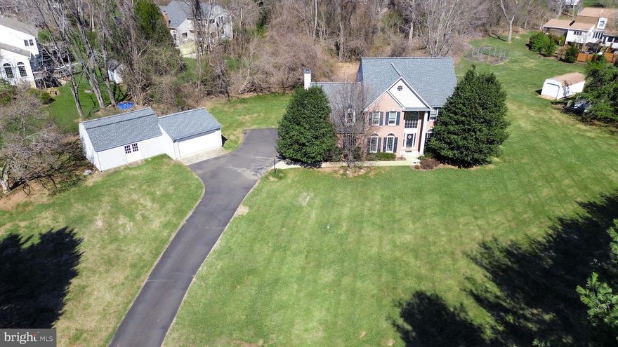 The one you've been waiting for! Located in the desirable Colchester Hunt neighborhood on a quiet cul-de-sac and renovated with care, this immaculate home with over $200,000 in upgrades is an exceptional offering and truly move-in ready. An acre lot with a huge front yard and mature trees welcome you to this brick-front colonial with four bedrooms, 3 full and 1 half baths. An open floor plan accommodates both group entertaining and comfortable family living. This meticulously maintained home is updated throughout including a new kitchen, complete new HVAC and architectural roof, gutters and siding all done in 2022. The main level features a two story foyer that brings in an abundance of natural light. The renovated chef’s kitchen includes an island with counter seating, stainless steel appliances, 42” cabinetry and granite countertops. The adjacent breakfast area opens to the screened in porch and deck where many hours relaxing, bird and nature watching await. The area flows seamlessly not only outdoors but also to the family room featuring a gas fireplace and large windows to let the sun shine in. A home office, living room, dining room, powder room and laundry room complete the main level living space. Next, step up the curved staircase to an expansive upper level. The primary suite features a walk-in closet and spa-like bathroom with double vanities, raised countertop, glass enclosed shower and soaking tub. This level also includes three additional good sized bedrooms with ample closets and another full bathroom. The lower level features a recreation room, full bathroom, flex space with a wet bar, storage space galore and walk up steps to the backyard. The abundance of lower level storage space with shelving will help keep your personal items organized and within easy reach. The fenced in backyard is great for Fido.  The property also features a 2 car detached garage and large workshop. The workshop is perfect for a man cave, gardening or hobby headquarters. Located in the Robinson Secondary School Pyramid, an International Baccalaureate World School.  Less than 3 miles to historic & quaint Clifton.  Fifteen minutes to George Mason University.  Easy access to Fairfax County Parkway, Route 123 and major commuter routes.  Near several recreation areas including Hemlock Overlook, Burke Lake Park & Fountainhead.  Don't miss it! Open House Friday, March 28 from 5-7 pm and Sunday, March 30 from 1 -3 pm.  Please submit any offers by noon on Monday, March 31.