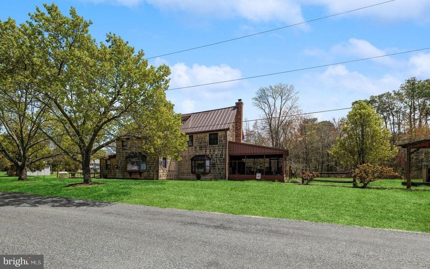 Nestled on 3.25 acres, this remarkable property with 300+/- feet of shoreline offers breathtaking views of the Nanticoke River and unforgettable sunsets.  Step onto the spacious 'T-Pier' and dock your boat equipped with a 'Hi N Dry' Boat Lift and convenient fish-cleaning station.
Dating back to the early 1900s, this home exudes charm and character.  The main level welcomes you with a kitchen that opens into the family room, while the original section of the home features a cozy living room and dining room.  A versatile sunroom, perfect for an office or 'mancave', adds to the home's allure.
Upstairs, there are two bedrooms and a bonus room, currently used as an office. Almost every room offers serene views of the Nanticoke River. 
Outside, a screened porch off the kitchen area provides another vantage point to enjoy The Nanticoke.  The sellers have lovingly maintained this cherished home, with recent updates including a new furnace (2022) , water heater (2022), windows (2014), washer & dryer, metal roof, and a BAT septic system (2011). The owner's primary bathroom was also remodeled in 2017.
With plenty of potential to add your personal touch, this property is being sold as-is. Don't miss the opportunity to own your very own waterfront gem.  Schedule your showing today!