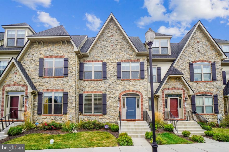 Timeless elegance meets modern sophistication in this exquisite four-level townhome located in the prestigious Mill Island enclave of Worman’s Mill. With close to  3,000 square feet of impeccably curated living space, this residence offers a rare blend of architectural charm, upscale finishes, and thoughtful design. From the moment you arrive, the stately stone front façade and classic colonial French lines set the tone for what lies within. Step through the arched entryway into a light-filled interior adorned with custom window treatments, including plantation shutters and tailored blinds that enhance both privacy and style. The main level boasts an open-concept layout ideal for entertaining, anchored by a gourmet kitchen featuring upgraded cabinets, back-splash,  countertops, and stainless steel appliances. Adjacent, the spacious great room flows seamlessly into a private rear courtyard—perfect for al fresco dining or quiet morning coffee. A standout feature is the library/study, enclosed by elegant custom barn doors, offering a serene retreat for work or reading. Upstairs, the owner’s suite is a sanctuary of comfort, complete with tray ceilings, dual walk-in closets, and a spa-inspired bath showcasing designer tilework, a freestanding soaking tub, and a glass-enclosed shower with built-in seating. The top-level loft provides a versatile space for lounging or entertaining, opening onto a covered sky terrace with sweeping views—ideal for sunset cocktails or stargazing. The lower level is equally impressive, featuring a wet bar, expansive family/rec room, and full bath, creating the perfect setting for game nights or guest accommodations. Additional highlights include a rear-entry two-car garage, upgraded lighting throughout, and access to the vibrant Worman’s Mill Village Center, with boutique shopping, dining, and community events just steps away. Conveniently located near Rt. 15, I-270, and I-70, this home offers effortless access to downtown Frederick and beyond.  2548 Island Grove Blvd is more than a residence—it’s a lifestyle. Experience refined living in one of Frederick’s most coveted communities.