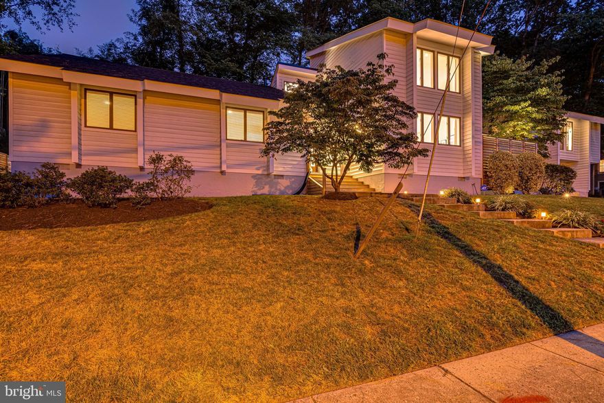 Let your eyes feast on this totally transformed contemporary. Located in the highly sought-after neighborhood of Bellevue Forest this 4BR 3BA home just 1 stop light to DC was fully renovated over the last 3 years creating a tranquil contemporary retreat. The exterior updates include new rear, side and front IPE wood decks and stairs; a beautiful white granite stone wall; new opaque glass garage doors and plenty of lighting and sculpture in the rear multilevel deck area creating a private oasis. The inside highlights include stunning white oak flooring, a 2-sided gas fireplace, 12-18 foot vaulted ceilings in multiple rooms, an exquisite kitchen with quartz counter tops Sub-Zero fridge, Wolf range, Sub-Zero wine wall and an expansive island great for entertaining. The kitchen opens to the family room on one end and the dining room on the other and has easy access to the rear deck. The living and dining rooms are spacious and adjoining giving this main living area a wonderful circular flow. The main level is complete with 2 bedrooms, a lovely hall bath, a 2nd master bedroom with private deck and ensuite bath complete with soaking tub and shower stall. The main master suite on the other end of this expansive home transitions you into a resort-like space. Vaulted ceilings in the master; an enormous walk in closet with loads of natural light and an amazing master bath with heated floors, a teak wrapped soaking tub, an expansive vanity with 2 sinks and plenty of storage can only be topped by the walk-in steam shower. The suite is complete with an exercise room full of windows and opening to an upper level rear deck. Don't missing visiting this stunning home.