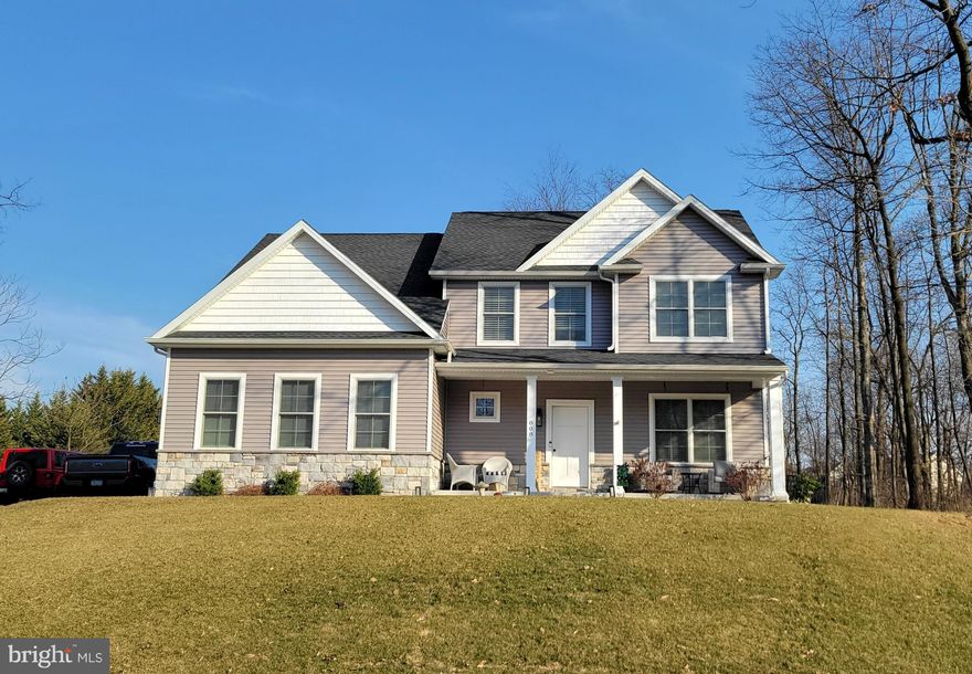 Picturesque Setting - Like-New Colonial built in 2021, offering privacy with woods on both sides.   Enjoy modern granite kitchen with S/S appliances, adjacent family room with cozy gas fireplace, separate dining room for entertaining in style.   Beautiful luxury vinyl flooring throughout main level.  Upper level has 4 bedrooms, 2 full baths and convenient laundry facilities.   Master suite has tray ceilings, double vanity and two walk-in closets.   Lower level rec room/game room is an entertainment haven, perfect for game or movie night.   Love that covered back porch  for relaxing and entertaining.   Fenced back yard and 16x10 shed for added functionality.   Quality built by Pinnacle Homes.  Don't miss this gem, call today to schedule your tour of this one-owner home in desirable Laurich Ridge.