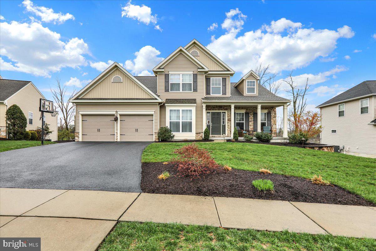 This meticulously kept sunny open concept home is just what you've been looking for. Entering this stunning home from the covered front porch, you will find an impressive private office with a glass door. Invite everyone over for a holiday dinner, your dining room is just the right size. For those who love to cook the kitchen is sure to delight. This well designed kitchen includes a breakfast area, hard surface countertops, an island and ample cabinet and counter space. Relax in front of the fireplace in the family room or enjoy your wonderful sunroom which features a sliding door to the rear deck. The first floor also has a spacious primary suite which features a private bath with double sinks and a large walk in shower. There is also a walk in closet boasting custom organizers. Heading upstairs you will find two other nice size bedrooms as well as another huge bedroom with a walk in closet and a hall bath. The basement with extra high ceilings is unfinished with roughed in plumbing for another bath. A sliding door leads to a lovely rear patio as well. Some other outstanding features of this home are the 9 ft. ceilings throughout, tilt in windows, gutter guards, a two year old gas water heater and a oversized two car garage. Welcome Home!