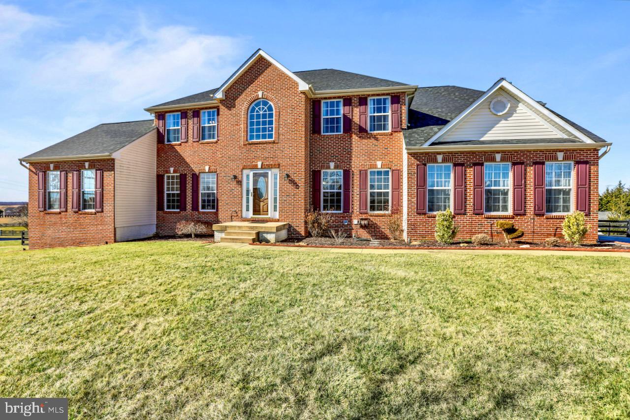 Absolutely stunning 3 level Brick front Colonial in Spruce Hill Subdivision resting on 1+ acre of land with mountain views! Enter through the two level Foyer with hardwood flooring and 2 storage closets. Additional Main level features include the Gourmet Kitchen with island, breakfast bar, granite counter tops, stainless appliance package, double wall oven, desk area, and adjoining breakfast room. Family Room with stone wood burning fireplace, Sunroom with cathedral ceilings, Formal Living and Dining Room, Great Room with cathedral ceiling, Private Home Office, half bath, and laundry. Upper level has 4 Bedrooms and 3 Full Baths including the Primary Owner's Suite with large walk in closet, and attached luxury bath with double sink, soaking tub, and stall shower. Two Junior Bedrooms are nicely sized with a Jack-n-Jill layout sharing a full bath. Last there is the Princess Suite with attached private bath. Fully finished Lower Level with large Recreation/Game Room, Den which could easily serve as another office, bedroom, or craft room, a 5th Bedroom, and Full Bath. Walk out to the fully fenced rear yard with patio space, large deck, storage shed, and balcony with conveying porch swing to watch the beautiful sunsets over the mountains! Large paved driveway and 2 car side load garage offer ample parking! Located just off the main Roadway which is perfect for the commuter, across the street from Washington High School, and minutes to downtown historic Charles Town with plenty of shopping and Dining Options. 15 minutes to Harpers Ferry with an abundance of outdoor activities!! **NEW HOT WATER HEATER, SUMP PUMP, SMOKE DETECTORS***Appliance package installed in 2021, Roof replaced in 2018, and HVAC replaced in 2017***