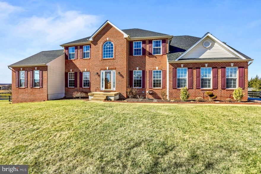 Absolutely stunning 3 level Brick front Colonial in Spruce Hill Subdivision resting on 1+ acre of land with mountain views! Enter through the two level Foyer with hardwood flooring and 2 storage closets. Additional Main level features include the Gourmet Kitchen with island, breakfast bar, granite counter tops, stainless appliance package, double wall oven, desk area, and adjoining breakfast room. Family Room with stone wood burning fireplace, Sunroom with cathedral ceilings, Formal Living and Dining Room, Great Room with cathedral ceiling, Private Home Office, half bath, and laundry. Upper level has 4 Bedrooms and 3 Full Baths including the Primary Owner's Suite with large walk in closet, and attached luxury bath with double sink, soaking tub, and stall shower. Two Junior Bedrooms are nicely sized with a Jack-n-Jill layout sharing a full bath. Last there is the Princess Suite with attached private bath. Fully finished Lower Level with large Recreation/Game Room, Den which could easily serve as another office, bedroom, or craft room, a 5th Bedroom, and Full Bath. Walk out to the fully fenced rear yard with patio space, large deck, storage shed, and balcony with conveying  porch swing to watch the beautiful sunsets over the mountains! Large paved driveway and 2 car side load garage offer ample parking! Located just off the main Roadway which is perfect for the commuter, across the street from Washington High School, and minutes to downtown historic Charles Town with plenty of shopping and Dining Options.  15 minutes to Harpers Ferry with an abundance of outdoor activities!! **NEW HOT WATER HEATER, SUMP PUMP, SMOKE DETECTORS***Appliance package installed in 2021, Roof replaced in 2018, and HVAC replaced in 2017***