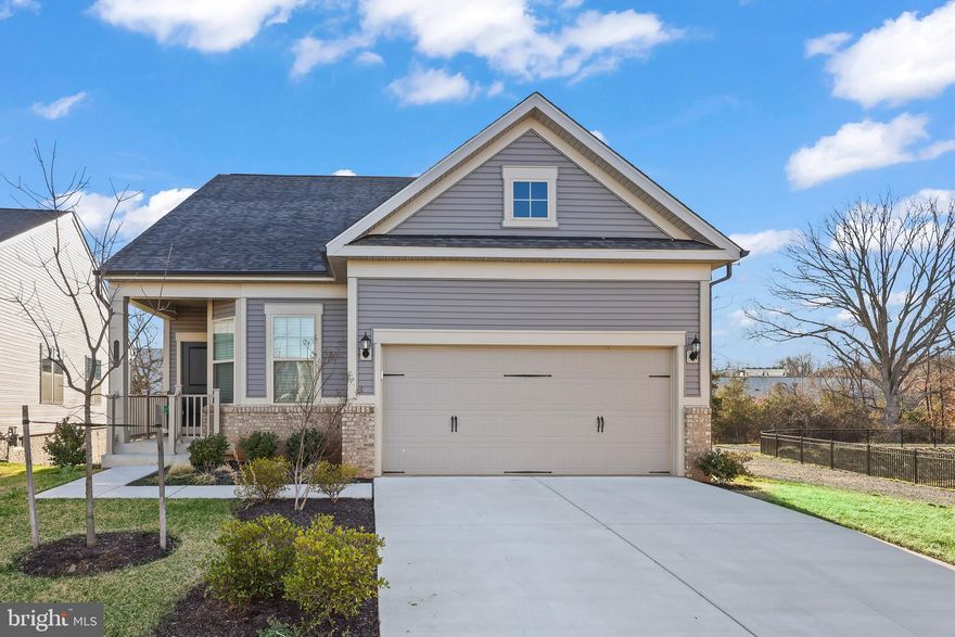 Welcome home to 6575 Petunia Terrace, a gorgeous stand alone home built in 2022 overlooking the pond in Carter's Mill, Haymarket’s sought-after 55+ active adult community. This 4 bed, 4 full bath home with a two car garage was a premium lot choice when the neighborhood was constructed, given its privacy with the pond to its right, trees in the rear, and its tucked away interior location. Upon entering under the quaint covered porch, an eat-in kitchen at the front of the home overlooks the dining and gathering rooms, ideal for entertaining. The primary suite boasts a huge walk-in closet & spacious ensuite bath. There is also a secondary bedroom, currently used as an office, on the main floor overlooking the pond with an adjacent full bathroom. The owner spared no expense when choosing add ons during initial construction, including an irrigation system for the front and back yards, the second floor loft, bedroom, and full bath, as well as the extended sunroom off the living room which leads out to the deck overlooking the pond, perfect for indoor/outdoor living. The fully finished walkout basement is expansive and exits to the fully fenced backyard, another add on by the owner. The fourth bedroom is tucked away in the corner of the basement, with a full window and an adjacent full bathroom. A wall can easily enclose the space if more privacy is desired. Enjoy a 14,000 sq. ft. clubhouse with an indoor & outdoor pool, spa, fitness & yoga rooms, outdoor bocce ball and pickleball courts, community garden, walking trails and more. Live close to shopping, restaurants, wineries & breweries, and major roadways including i66 and Route 29.