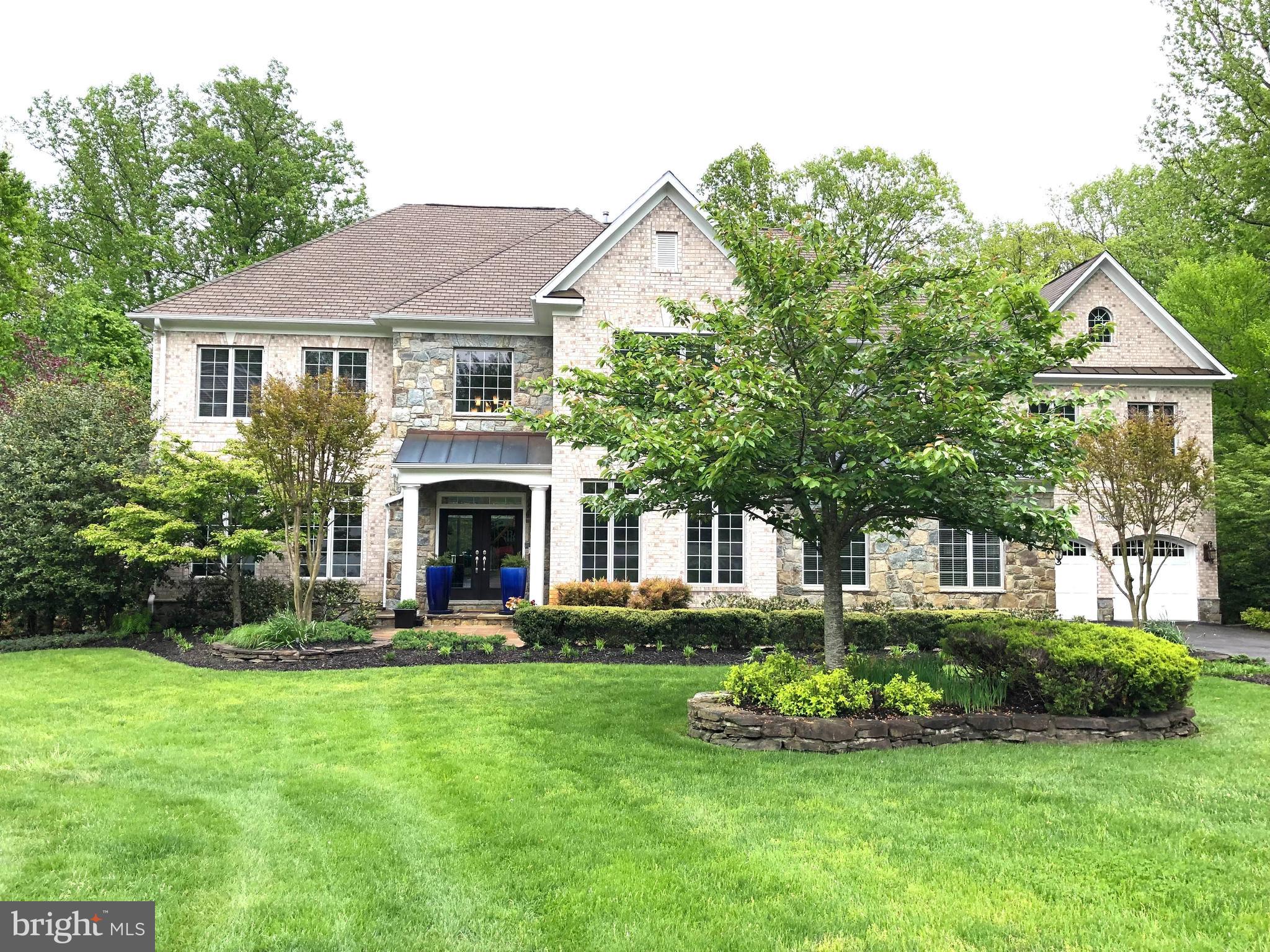 This beautiful custom-built "Award Winning" colonial estate is situated in the much sought-after "Wyatts Hill Community, on a 3.55-acre culdesac lot. Subtle yet sophisticated elegance best describes this immaculately appointed home that offers 1 primary suite w/ 3 gas FP & surrounds sound. Also has a sitting area & dry bar w/a wine refrig. , his&her closets & master bath w/walk-in shower & jacuzzi tub. The addl 5TH bedroom incl the au pair suite/studio, 5 full ba & 3 half baths. Walk into the 2-story foyer with a curved staircase and gorgeous hardwood & European lighting. Custom molding, coffer ceilings & custom plantation shutters greet you w/ this open floor plan that is excellent for entertaining. Main level office w/custom built-ins and adjoining Florida room, 2 story family room w/gas FP & floor to ceiling casement windows w/ wooded vistas and a surround music system throughout the home. A gourmet kitchen w/a breakfast nook & coffee bar. granite tops & SS GE appliances. Upstair mudroom, 3 Staircases taking you to 2nd flr. Bmnt has high ceilings w/theater rm and 2nd ktn w/o to Pennsylvania stone patio pool & custom lighting. 4 car garage, irrigation custom landscaping & a wrap-around deck. Exercise rm, Parking for 10 cars in the driveway. Porcelain Floors. There is a fireplace in the living room, a fireplace in the primary bedroom and a fireplace in the rec room.