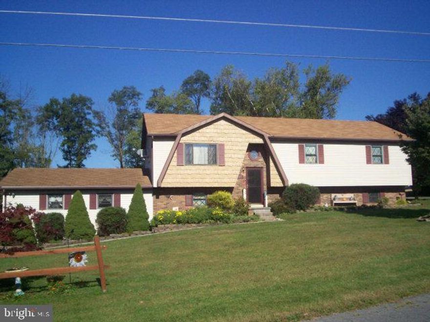 Beautiful bi-level - move right into this 3 bedroom, 2 bath home; enclosed back porch, tilt-in windows, coal stove in family room, above ground pool, awesome workshop & office; watch the deer in you yard!!!