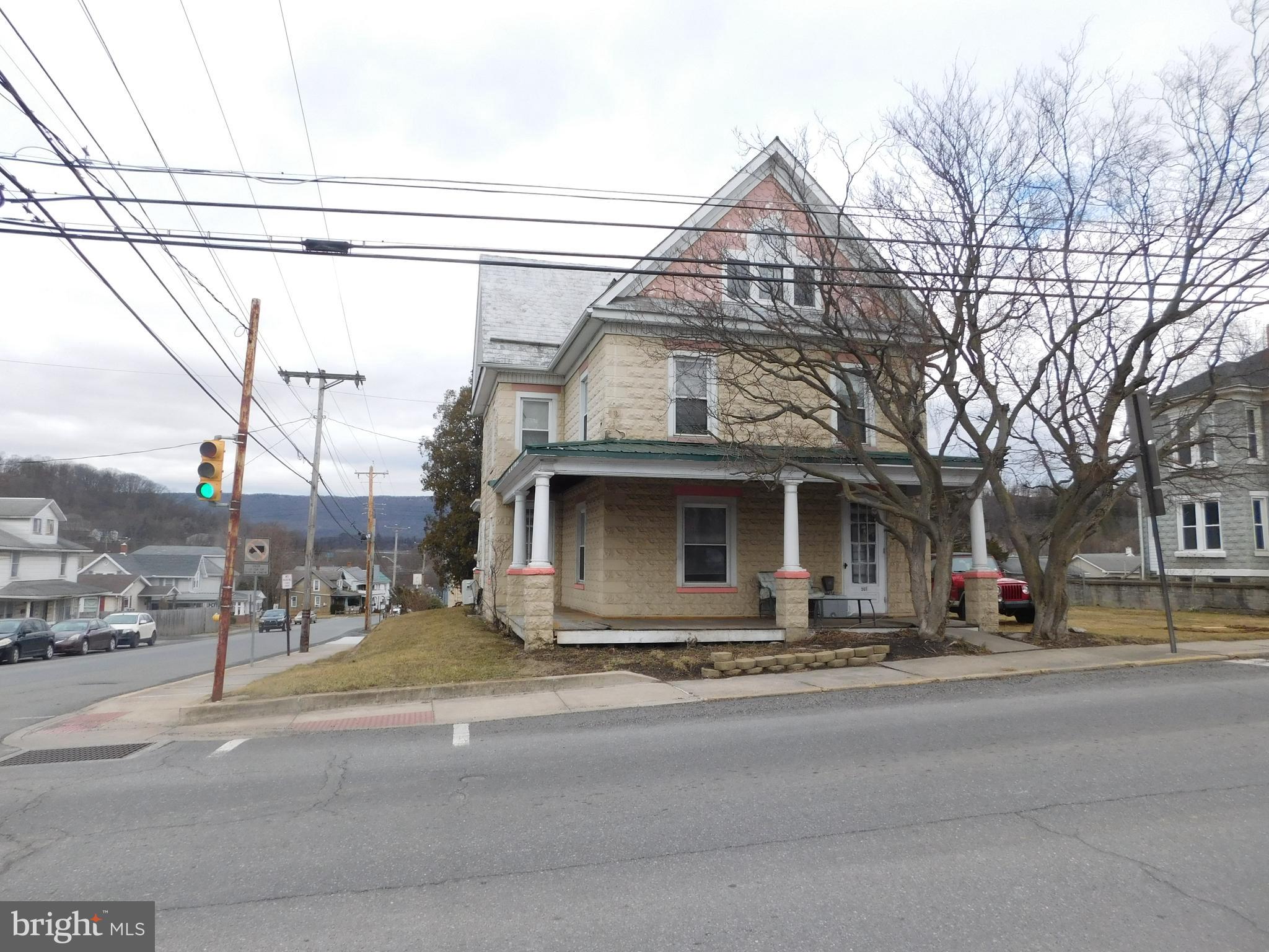 large 4 bedroom, 2 bath home! This large home sitting on a corner lot just needs a little TLC. full bath on the first floor and 4 bedrooms plus full bath on the second floor; fenced in yard plus a garage