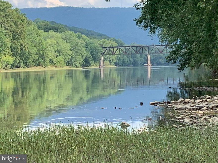 This 7 Acres is located along the Potomac River near Magnolia in Western Morgan County. Very nice mostly level lot with water frontage.  Lots of room for building and camping sites. Some cleared areas and also large trees. Small wet weather stream runs through the property,  Bring the Camper and enjoy  this recreational  waterfront property. Just 2.7 miles from Magnolia road on Low Line Road. Property is located on both sides of the B&O Right of Way.