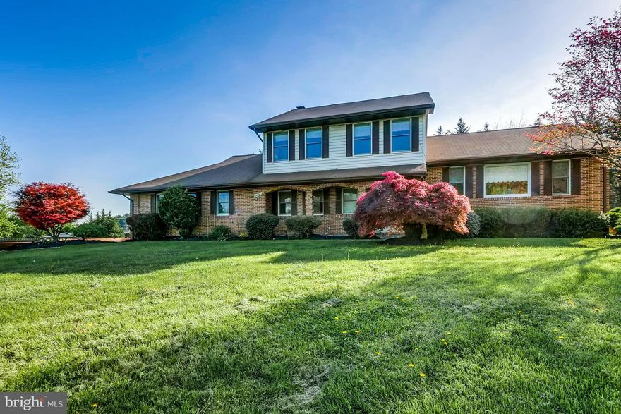 Charming 4 level split on over an acre, apprx 100 feet front stone paved driveway, 2 car garage, enter into a mud room off the family room, brick wall fire place, kitchen over looks into family room, hardwood flooring, new carpet, fresh paint, granite counter tops, crown molding in master suite, large deck off kitchen.