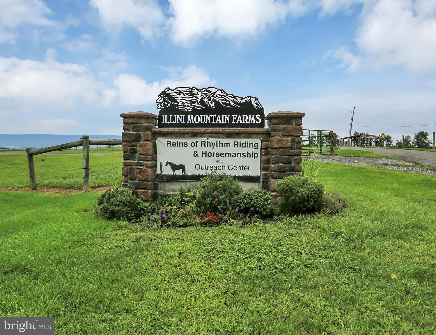 103.50 Acre Equestrian Center has Million Dollar Views for Miles and Miles!! On a Clear Day You Can See Forever!! This incredible horse farm includes 80x100 Riding Arena, 40x40 Machine Shed, 32x70 Bank Barn for Hay with 7 Horse Stalls, and a 42x70 Building that housed a Veterinary Clinic. Beautiful pastures with 7 Hay Feeders, and 4 Run In Sheds. Incredible 5,300 sq. ft. Home boasting 5 Bedrooms, 4 1/2 Baths, 2 Kitchens, Stone Fireplace in Great Room , Wood Stove on Lower Level. State of the Art Custom Kitchen w/Granite counters, and all Appliances., Laundry Room on Main Level and Laundry Area on Upper Level. Master Bath has Ceramic Tile Shower and Jacuzzi . Upper Level Family Room. Lower Level has Bedroom, Bath and Kitchen, and could be In-Law Suite. Over Sized 2 Car Garage. Rear Deck runs along Rear of Home and boasts a Swimming Pool/ Spa and Flowing Fountain. Large solar system reduces electric costs to about $150 per month and brings in annuities of about $700 per year.