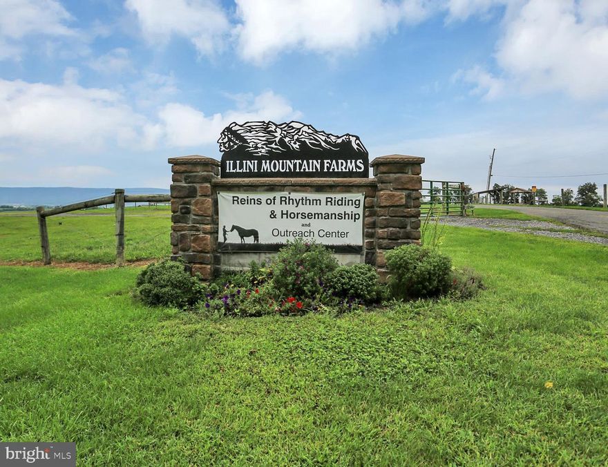 103.50 Acre Equestrian Center has Million Dollar Views for Miles and Miles!! On a Clear Day You Can See Forever!! This incredible horse farm includes 80x100 Riding Arena, 40x40 Machine Shed, 32x70 Bank Barn for Hay with 7 Horse Stalls,  and a 42x70  Building that housed a Veterinary Clinic.  Beautiful pastures with 7 Hay Feeders, and 4 Run In Sheds. Incredible 5,300 sq. ft. Home boasting 5 Bedrooms, 4 1/2 Baths, 2 Kitchens, Stone Fireplace in Great Room , Wood Stove on Lower Level. State of the Art Custom Kitchen w/Granite counters, and all Appliances., Laundry Room on Main Level and Laundry Area on Upper Level. Master Bath has Ceramic Tile Shower and Jacuzzi . Upper Level Family Room. Lower Level has Bedroom, Bath and Kitchen, and could be In-Law Suite. Over Sized 2 Car Garage. Rear Deck runs along Rear of Home and boasts  a Swimming Pool/ Spa and Flowing Fountain. Large solar system reduces electric costs to about $150 per month and brings in annuities of about $700 per year.