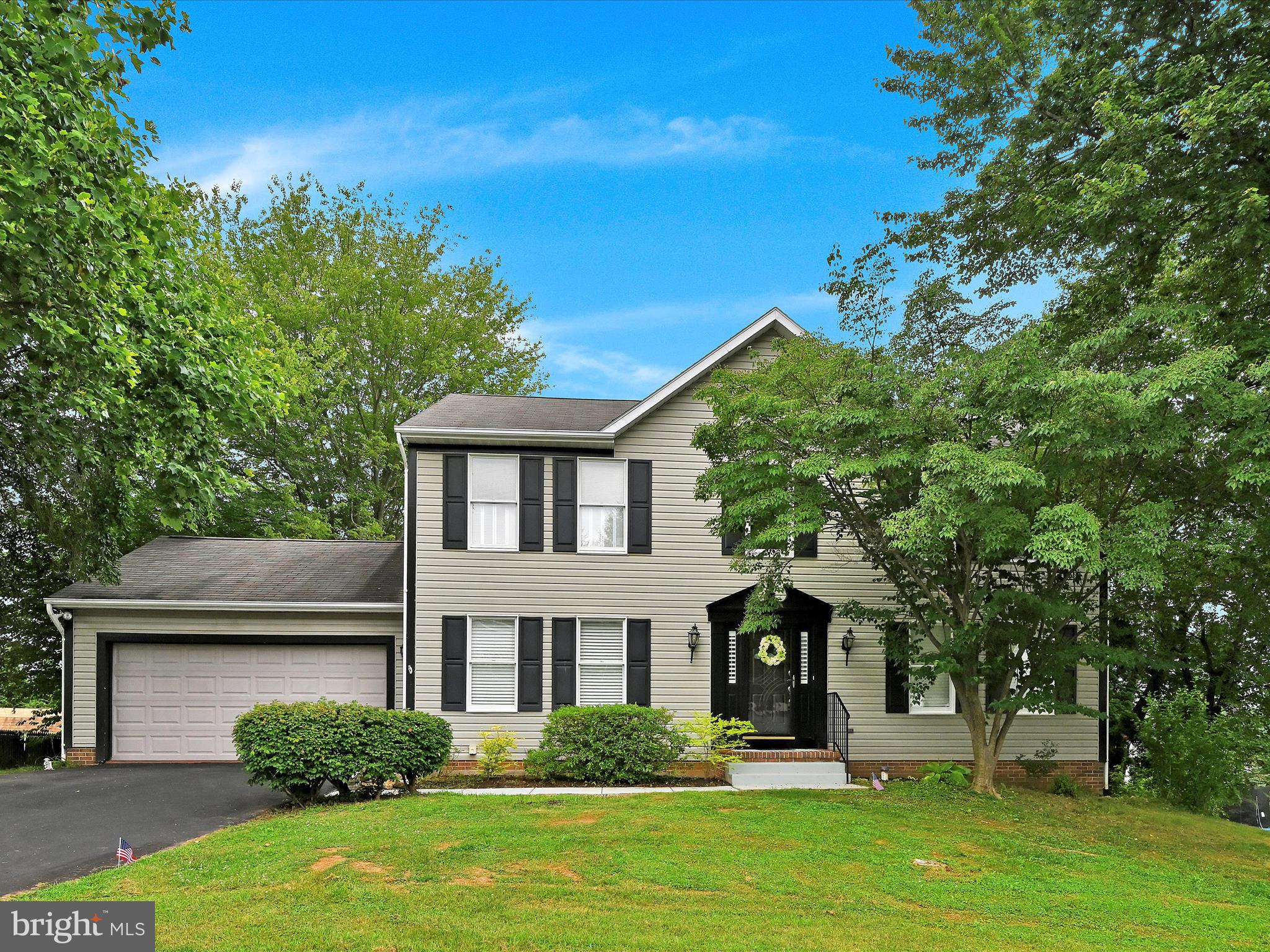 Welcome to this beautifully updated Colonial nestled on a spacious 1/3-acre lot in the heart of New Freedom! Impeccably maintained and truly one-of-a-kind, this charming home offers over 3,000 square feet of finished living space designed for comfort and style. Step into the stunning remodeled kitchen, featuring stainless steel appliances, a double oven, country sink, canopy range hood, granite countertops, soft-close cabinetry, and a large see-through pantry—perfect for the home chef. The kitchen opens to an inviting dining area, complete with chair rail molding and easy-care vinyl flooring found throughout the main level. Entertain with ease in the expansive family room, where a cozy gas fireplace creates the ideal gathering spot, flowing seamlessly through an elegant arched doorway to the living area. A convenient half bath is tucked right in the center. Upstairs, you’ll find three generous bedrooms, including a spacious primary suite with a walk-in closet and an updated en-suite bath featuring a tiled walk-in shower, double sinks and a dedicated makeup vanity. The large finished walkout basement offers nearly 1,000 additional square feet—plenty of space for a recreation room, home gym, or an extra bedroom—with a half bath already in place. Enjoy the outdoors in your private, tree-lined backyard from the expansive, nearly 300 SF screened-in porch or relax on the attached deck with custom railing—ideal for summer entertaining and quiet evenings alike. Major utility updates add peace of mind, including a new furnace in 2020, new AC in 2021 and a new hot water heater in 2025. Don’t miss your chance to make this beautifully cared-for gem your forever home—schedule your private showing today!