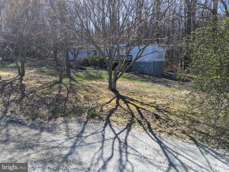 The  trailer is not livable.. value is in the lot... Fantastic Opportunity to live and own your own park-like wooded 5 acre building lot! There is an old trailer on the property.. so ther is well, septic and electric.  Ready for you to build your own dream home and surround yourself in nature! –Located in the Maryland Wineries Association's newest wine trail, "Legacy Wine Trail" and just minutes away from the Merkle Wildlife Sanctuary, the Jug Bay - Patuxent River Park System and in Prince George's County's "Rural Tier," this is an opportunity that shouldn't be passed up!** **The beautiful private wooded lot is in sought-after Brandywine