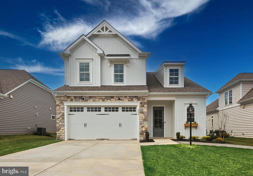 Experience refined living in this exceptional detached home in the prestigious gated community of Bulle Rock in historic Havre de Grace, Maryland. Every detail of this residence has been thoughtfully designed to blend timeless craftsmanship with modern luxury. The main level impresses with a gourmet kitchen featuring quartz countertops, designer backsplash, gold fixtures, and a custom walk-in pantry. The formal dining room showcases a stunning brick groin-vault ceiling—an architectural centerpiece that elevates every gathering. The main floor primary suite offers a serene retreat with a coffered ceiling and a spa-inspired bath complete with a zero-threshold shower and floating vanity. The finished lower level is built for both fun and function, featuring a custom wet bar, dedicated playroom, and a one-of-a-kind indoor dog house. Outdoor living is equally impressive, with a covered porch, fireplace, and striking tile accent wall—perfect for entertaining or relaxing year-round. Residents of Bulle Rock enjoy world-class amenities, including a 37,000 sq. ft. Residents’ Club with full gym, indoor and outdoor pools, tennis and pickleball courts, and more—all within a secure, resort-style community just minutes from the charm of downtown Havre de Grace. Luxury, comfort, and craftsmanship come together beautifully in this one-of-a-kind Bulle Rock home.