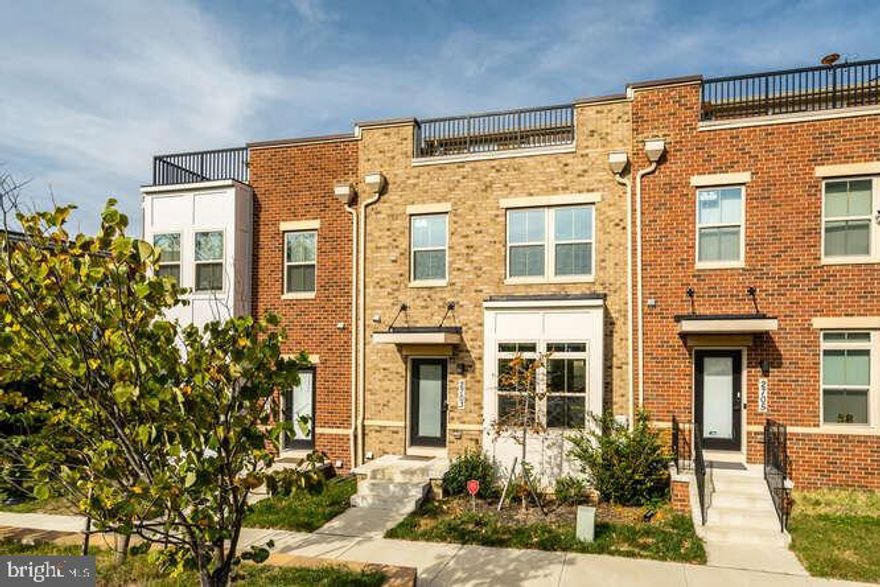 Modern 4-Bedroom Townhome in Hyattsville

This four-bedroom, three-full-bath, two-half-bath townhouse in Hyattsville feels like new—without the wait of new construction. With modern finishes, a flexible layout, and thoughtful upgrades throughout, it’s ideal whether you’re working from home, commuting into D.C., or simply seeking more functional space.

The main level offers an open-concept design that perfectly connects the living room, dining area, and gourmet kitchen. Featuring sleek cabinetry, frost white quartz countertops, and high-end stainless steel appliances, the kitchen is both stylish and functional. Step directly onto the private deck—ideal for morning coffee, grilling, or relaxing outdoors. A convenient half bath completes this level.

Upstairs, the primary suite serves as a peaceful retreat with a spacious walk-in closet and a spa-inspired en suite bath with dual vanities. Two additional bedrooms and a full bath are located nearby, offering ample space for family, guests, or a home office.

The top floor includes a fourth bedroom, another full bath, and a private rooftop terrace—perfect for entertaining or enjoying quiet evenings under the stars.

The fully finished lower level provides even more flexibility, ideal for a gym, media room, or play space. A half bath adds extra convenience on this level. Additional highlights include dual-zone HVAC, upgraded thermostats, and a spacious two-car garage.

Located just steps from the neighborhood playground and under 10 minutes from the Hyattsville Metro, the University of Maryland, and Prince George’s Plaza, you’ll enjoy the perfect balance of suburban tranquility and urban convenience.