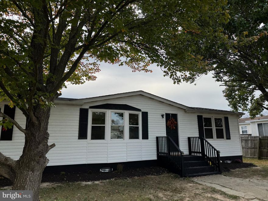 Discover the charm of this completely renovated three-bedroom, two-bath home. From the moment you step inside, you'll feel the quality and care of a top-to-bottom refresh, with new features throughout. The heart of the home is a beautifully laid-out, open kitchen with crisp white cabinets, stylish black hardware, and sparkling granite counters. Stainless steel appliances complete the sophisticated look. Thoughtful recessed lighting in the kitchen and dining area ensures a warm, welcoming ambiance, perfect for creating new holiday memories. The spacious, open floor plan is ideal for hosting family dinners, while durable LVP flooring offers a low-maintenance solution for a busy lifestyle. A new deck off the main living area expands your space for relaxing outdoors.