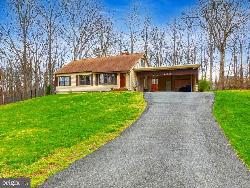 Beautiful Cape Cod style home close to Quantico MCB, Rt #95, Parks, Schools,Museums and no HOA!  This home is near everything but has a country feel as it sits back from the street on a beautiful 1/2 acre lot with a fully fenced backyard. Have your morning coffee or a barbecue on the oversized deck that offers privacy and a wonderful view of the trees. This lovely home is  ready for new owners with many updates including kitchen with new subway tile backsplash, quartz countertops and stainless steel appliances. 2 full and updated baths, all new custom exterior doors with between-the-glass blinds for ultimate privacy. Original hardwood floors throughout add to the charm and warmth of this light-filled 4 bedroom home.  A beautiful wood-burning fireplace is the focal point of the main living area! Carport easily holds two vehicles and the laundry room with a separate 2nd hot water heater can be found in utility room in the rear of carport.
 HVAC and Hot water heater replaced in 2017.  Crawlspace fully encapsulated in 2019. 
Come check out this home that offers the feeling of being secluded while also being easily accessible to many area activities including D.C.!