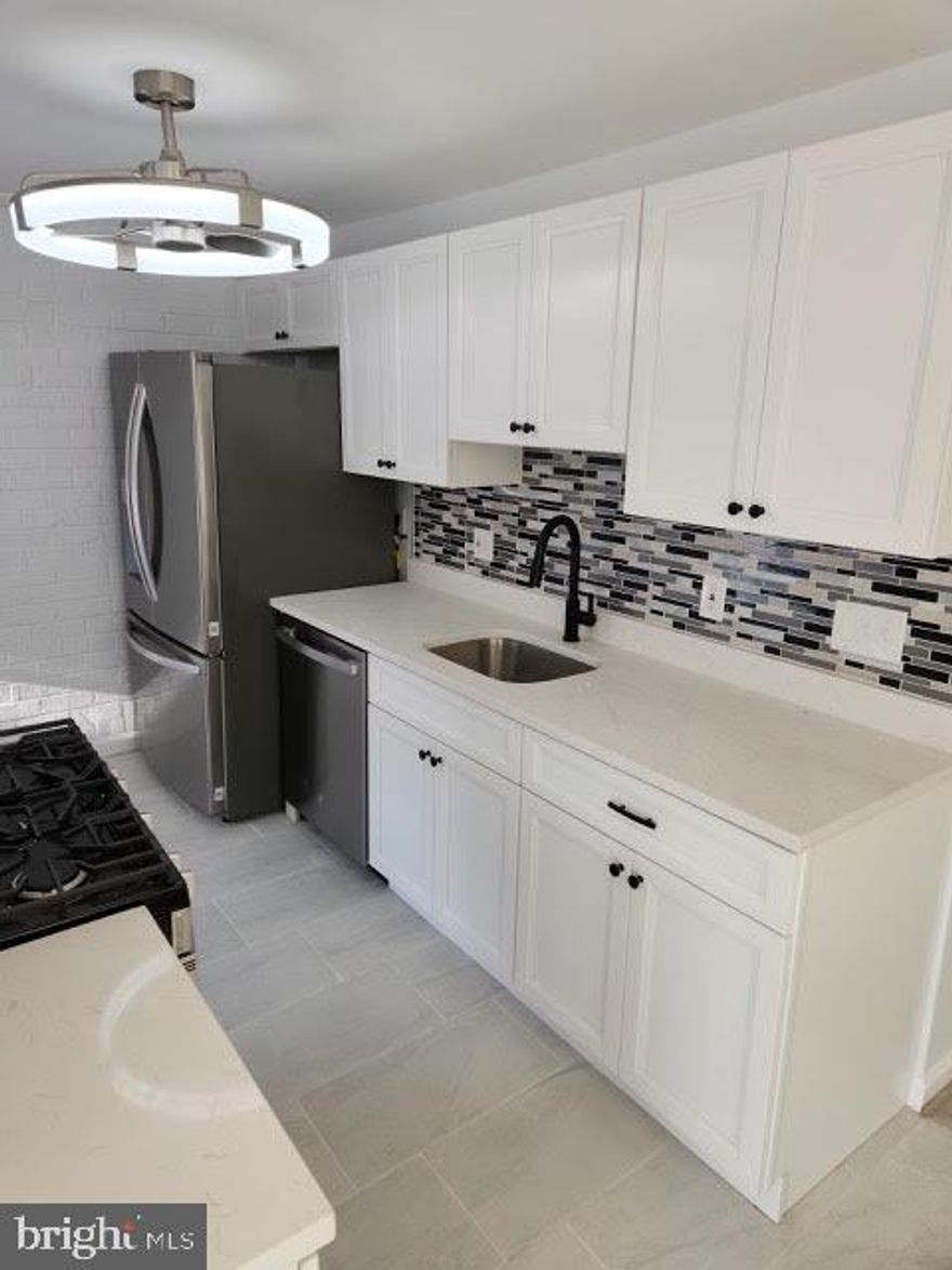 This is your opportunity to own a spacious, fully renovated 2-bedroom, 2-bath condo featuring an open floor plan and a generously sized living room. Every interior detail has been thoughtfully upgraded from floor to ceiling. Large windows fill the home with natural light and opens to a private balcony with peaceful, tranquil views. Both large bedrooms offer generous walk-in closets, and both full baths have been completely remodeled with new tile, modern vanities, LED lighting, and updated flooring. The beautifully updated kitchen showcases a newly added island, energy-efficient stainless-steel appliances, quartz countertops, and a stylish backsplash. Modern trim and finishes paired with a charming, exposed brick accent wall create a warm yet contemporary, modern-rustic aesthetic. Additional upgrades include brand-new luxury vinyl plank flooring throughout, all new lighting fixtures and chandeliers, added recessed lighting, fresh paint, new window treatments and contemporary shades for privacy, a brand-new HVAC system, and a convenient stackable front-loading washer and dryer. Best of all, ALL UTILITIES are included in the condo fee, including gas, water, and electric.  Huntley Square residents enjoy access to an outdoor pool, a party room, and an outdoor BBQ and grill area. The location is close to shopping and dining, National Harbor, MGM, Old Town Alexandria, and Andrews Air Force Base, with easy access to I-495, I-295, and Route 210, offering quick connections to Washington, DC and Northern Virginia.  **glass door in master bath shower and vanity in 2nd bath getting installed by Tuesday 10th**professional photos are forthcoming*