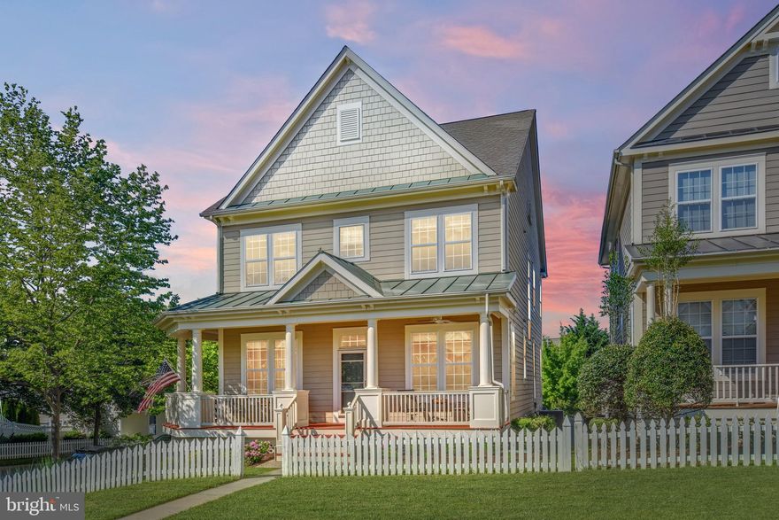 Wow! This lovely Villages of Urbana home has it all! Located in a prime location on a quiet green space and a short walk to schools, parks, and the new resort-style pool! Enjoy your morning coffee on the spacious wrap-around porches or the back deck. The flat, fenced backyard provides an oasis for playing and gardening or walk out from the finished lower level to entertain on the covered patio! This spacious light-filled home features a well-planned design and upgrades throughout--including gleaming hardwood floors, crown moldings and windows galore! On the main level, the dining area, living area, extra-large gourmet kitchen with morning room/ eating area and lovely family room--all provide plenty of living and entertaining space. The gourmet kitchen is a chef’s dream--with granite counters, loads of cabinetry, large center island and Stainless Steel appliances. Gather around the fireplace in the family room to watch TV or relax! Walk out to the deck overlooking the backyard. All this, plus a separate mudroom (with an extra-large closet).The upper level features four extra-large bedrooms--each with extra-spacious closets. The Owner’s Suite features a tray ceiling, sitting area space, two large walk-in closets and a luxury bath--with soaking tub, dual sinks and separate tiled shower. All this, plus a convenient hall bath and a convenient second-level laundry room with built-in cabinets! On the lower level, you’ll find a complete suite--perfect for an in-law suite, guest suite or complete area for everything you need to entertain! The design of the lower level rates an A+ and features a wet bar/kitchen area with granite counters, loads of cabinetry, and full-size refrigerator. Relax and watch TV or play games in the recreational areas (complete with a bonus nook for reading books!). All this, plus an extra-large bedroom (with spacious closet), another bonus room--perfect for a work-out room, craft room or an office--and two storage spaces! Walk out from the lower level to the patio, and fenced backyard--with access to the garage and a convenient gate for easy access to the alley. This beautiful home truly has something for everyone!