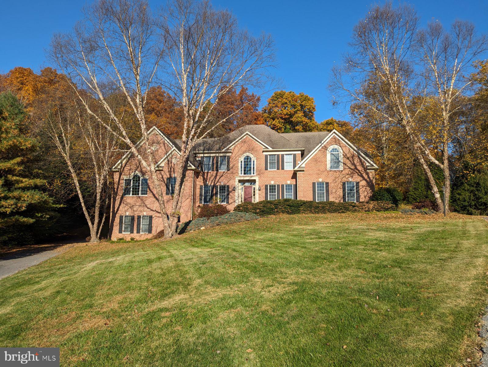 Wonderful Wellington. Welcome to this classic one of a kind home. Situated on 1.4 acres and plenty of space between neighbors, this is the place to call home. It's a picture perfect neighborhood where everyone waves hello. Minutes to Cattail Creek Country Club. Four bedrooms upstairs with an additional bedroom on the main level. Beautiful hardwood floors, 2 story foyer and a 2 story family room. The room over the garage is simply awesome. Three fireplaces. Fully finished basement with a full bathroom. Extensive hardscaping in the backyard. A 3-car garage with a lift and and another 2-car garage on the other side of the home. Community Title Preferred. Truly a must see!!