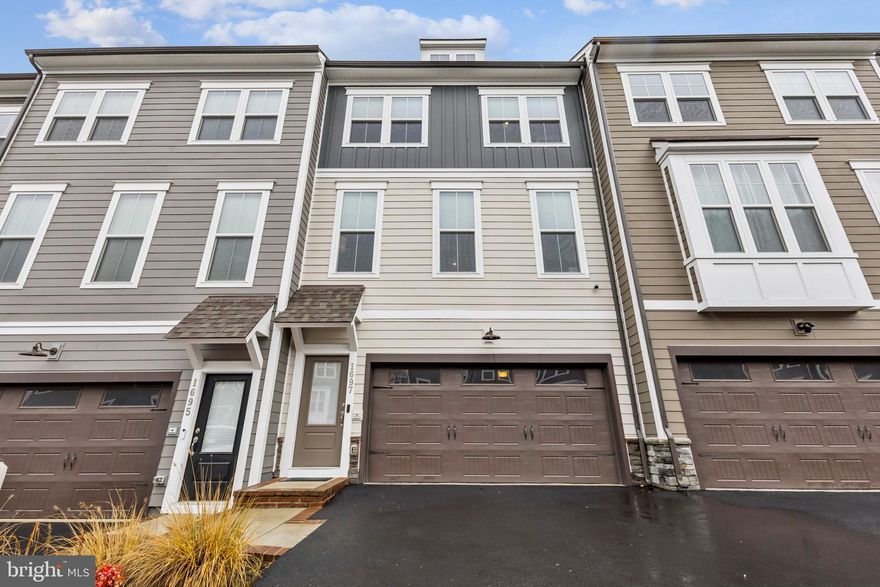 Exceptional Opportunity: Elegantly Designed Townhome in the Coveted Potomac Shores Community

Presenting an exquisite three-bedroom townhome with a two-car, front-load garage, ideally situated within the prestigious Potomac Shores Community. Constructed in 2022, this residence features a luminous, open-concept floor plan, meticulously designed to enhance modern living.

Interior Highlights:
The gourmet kitchen is a standout, boasting a spacious sit-down island, complemented by upgraded white cabinetry, elegant white quartz countertops, and high-end stainless steel appliances. The main level is adorned with luxurious LVP flooring, seamlessly connecting the expansive family room and the distinctive dining area—an inviting environment for relaxation and social gatherings. 

Step onto the deck to relish the invigorating outdoor air, perfect for entertaining guests or indulging in peaceful moments. Ascend to the second level, where the primary suite awaits, complete with an exquisite upgraded private en suite bath and an expansive walk-in closet, promising a sanctuary for unwinding after a long day. Additionally, two well-proportioned bedrooms and a guest bathroom are located down the hall, along with a conveniently positioned laundry room.

The lower level promises versatility with its ample open space, also featuring LVP flooring and direct access to the backyard. This area can effortlessly transform into a private home office, an additional guest suite with a full bath, or a delightful den for enjoying leisure activities.

Community Amenities:
Residents benefit from a multitude of community amenities covered by HOA fees, including high-speed Verizon FIOS internet, refuse removal, access to multiple pools, a clubhouse, and a fitness center. Embrace an active lifestyle with hiking and biking trails, multipurpose sports courts, and the prestigious Jack Nicklaus Signature golf course.

Prime Location:
Strategically located for ultimate convenience, this residence offers easy access to I-95, US-1, and Quantico, with a forthcoming VRE station expected to be less than half a mile away.