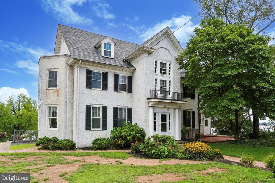 Welcome to 800 Radcliffe, a stately home combining timeless elegance with modern amenities, perfectly situated to capture breathtaking river views. This beautifully maintained residence boasts a stucco exterior accented by working wood louvered shutters and has recently been updated with brand-new shingle and flat roofs. The home features replaced windows throughout, ensuring energy efficiency while maintaining its classic charm.

As you approach the property, you are greeted by a brick walkway leading to the front door, flanked by matching brick sidewalks. The two-car garage offers ample parking and can be easily expanded. A standout feature is the expansive covered porch on the second floor, which spans three bedrooms and provides a serene outdoor space to enjoy the picturesque views. The lower basement level opens onto a brick patio, nestled among mature fig trees, perfect for outdoor entertaining.

Inside, the home offers 200 amp service, a whole-house generator, and efficient oil heat with hot water radiators and baseboard heating. There is central air conditioning on the first floor, while hardwood floors, large baseboards, and detailed moldings add warmth and character to every room.

The front family room, just off the kitchen, invites you to relax by the beautiful fireplace, which features a tile surround and a gas insert in the foyer. The kitchen, located at the rear of the house, overlooks the river and is equipped with a gas range, double sink, and ample cabinetry. The adjacent dining room, bathed in natural light from four large windows, offers stunning views of the river and flows seamlessly into the living room, where another fireplace awaits a gas insert.

A mudroom, located at the front left of the house, includes a full bathroom and washer/dryer hookups with a laundry tub, offering the potential for conversion into first-floor living quarters if desired. The oak staircase, with its exquisite craftsmanship, leads to the upper floors.

On the second floor, the master bedroom features a walk-in closet and a fireplace ready for a gas insert. The ensuite bathroom boasts a double sink, tile flooring and walls, and a custom walk-in shower that can easily be converted into a steam shower. The remodeled hall bathroom showcases classic white subway tile, while the second and third bedrooms offer direct access to the covered porch with serene river views. Finished woodwork, including crown molding, adorns these rooms from floor to ceiling.

The third floor houses four additional bedrooms, one with a private bath, and a hall bathroom, providing ample space for family and guests.

This property is being sold as is with the buyer being solely responsible for any repairs and/or certifications needed to obtain financing or the use and  occupancy from Bristol Borough

800 Radcliffe is a rare gem, offering the perfect blend of classic architectural details and modern comforts, all set against the backdrop of stunning river views. Don't miss the opportunity to make this exceptional property your new home.