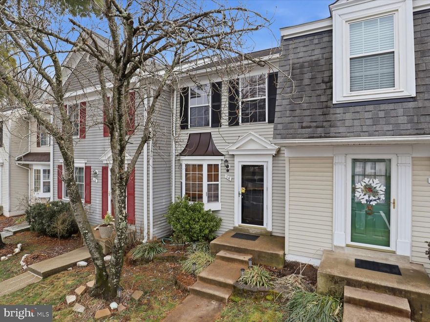 Welcome home to Countryside!  This well maintained home has everything you need.  Main level hardwood floors, newer painted walls with bump out in living area.  Kitchen is equipped with granite countertops, stainless appliances and ample cabinet space and has access to back deck that has been refreshed.  Yard is fenced and includes a shed also newly paneled. Upstairs is carpeted with two bedrooms and a shared hall bath with updated finishes and new vanity.   Upstairs closets are equipped with ELFA shelving.  The assigned parking spaces (#24) are directly in front of the home.  Custom wooden blinds installed on all windows.  Basement includes vinyl plank flooring with a large family room and a full bath. Incredible location - close to all the big stores, Algonkian park, One Loudoun, Dulles Town Center and more!    ** PHOTOS Coming Friday!