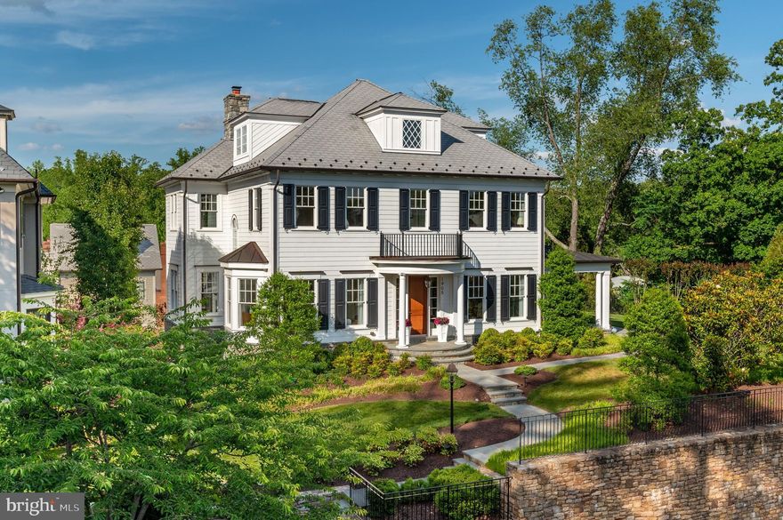 1905 Foxview Circle NW is an extraordinary residence in Foxhall that was designed by GTM Architects, built by Foxhall Builders in 2015, and is sited where the original 1801 Foxhall Valley Vista Estate was situated. Graced with a number of sophisticated features, this home is understated elegance from start to finish. The soaring ceilings and generous spaces create an experience of architectural balance and scale. The subtle detail moldings, handsome hardware, and stunning light selections complement each other perfectly as you explore each room. The property spans approximately 8,200 total SF and offers 6 Bedroom Suites, 6.5 Full Baths, 4 finished floors, and an Elevator. Set on a lush and landscaped 0.31-acre lot with a bright and sun-drenched southwestern exposure, this home has lovely outdoor spaces for entertaining and a discreet rear-facing 2-Car Garage. There is also an indoor golf simulator room! Situated in a private enclave of stately homes and nestled against Glover Archbold Park, 1905 Foxview Circle NW is minutes to Georgetown, surrounded by prominent embassies, and within close proximity to Downtown DC.