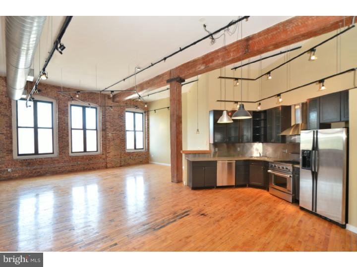 Welcome home! Design magazine-quality corner Loft!! 1400+/- Sq. ft. Over sized windows with abundant natural light. Amazing kitchen with unique glass cabinetry, stone counter tops, and stainless steel appliances. Exposed natural brick, custom steel, cedar-lined closet doors, exposed wood beams, gleaming maple hardwood floors and 3 walls of windows. Ceramic-tile bath with walk-in shower. There is parking on-site with an additional cost. There is a currently a waiting list,BUT! The current owner has leased a spot through the end of 2013, so you have first right to take over your own spot. Inventory in the area is dropping so this condo is going to sell quickly. Parking included in condo fee. Schedule your showing today!!!!! *NOTE* With an acceptable offer the seller is willing to add a build-out for a private bedroom.