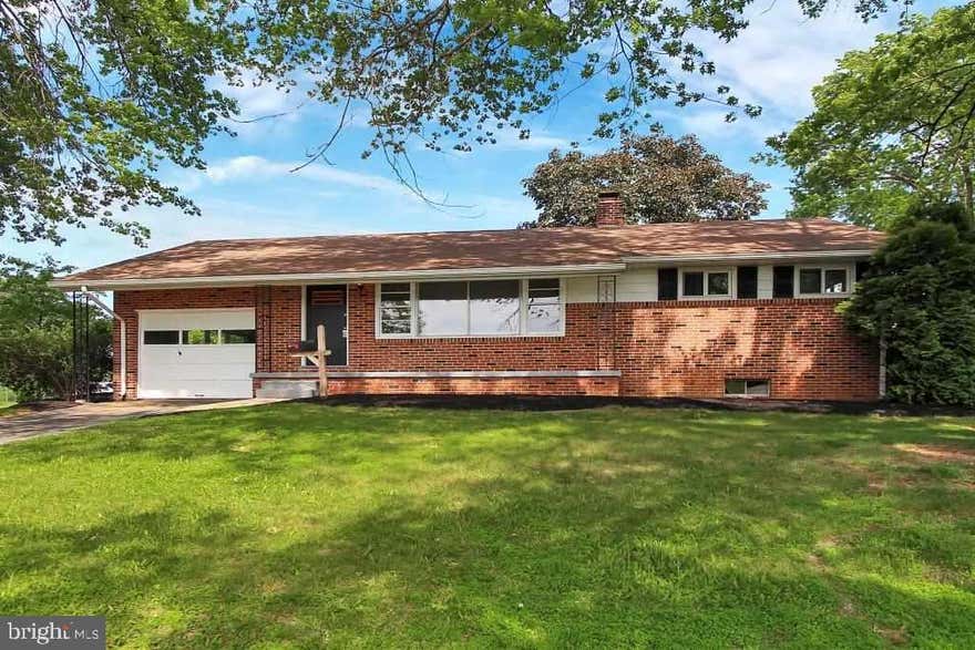 You'll love this freshly painted 3BRS, 1.5BA brick Rancher w/ open flr plan, hdwd flrs, gorgeous new full BA, sliders from DR open to covered patio, spacious LL FR or 3rd BR has new wall-to-wall carpet, walk-out BSMT.  Level, corner lot.  Close to I-83, Rt 30, schools & shopping!