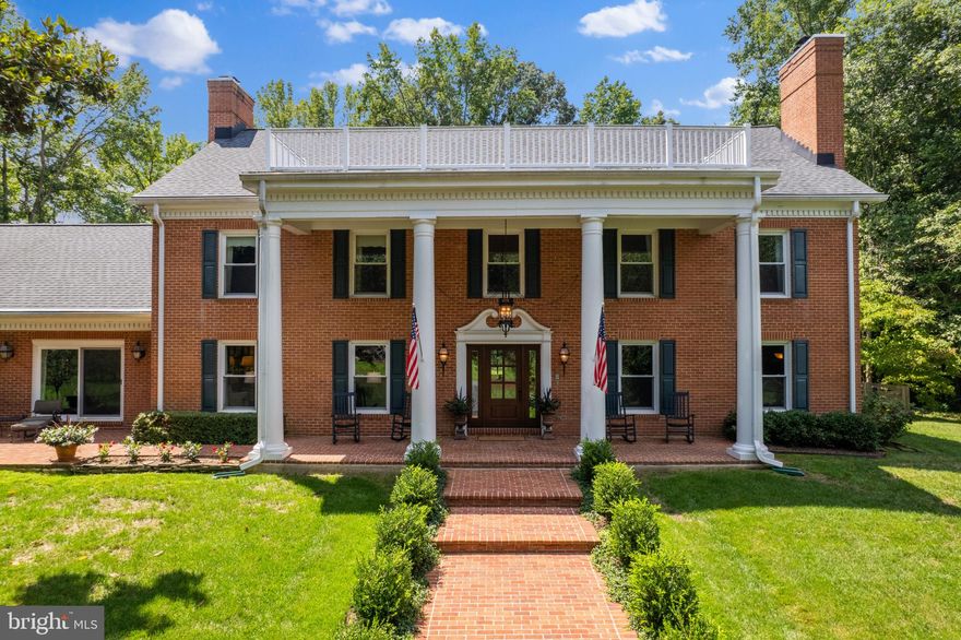 Welcome to 3890 Greenmeadow Lane! This stunning colonial style home situated on a gated 2.2 acre parcel is an absolute must see! This home has a stunning presence from Greenmeadow Lane as you head up the long driveway to the motor court and side entry garage. As you enter the home, surrounded by two story pillars, you'll be amazed at how spacious the main level of this home is. This level includes two rather large formal living rooms, a sizeable formal dining room, family room, eat-in kitchen, large laundry room, powder room, two fireplaces and a main level bedroom with private full bathroom. Headed upstairs, you'll find an extensive primary suite with fireplace, walk-in closet, large soaking tub, shower, two vanities and two toilets! There are two additional bedrooms on the upper level and a hall bathroom. Headed downstairs to the lower level you will find the access to the oversized garage, billiards room, family room, an enormous amount of storage and a bonus room which could be used as a home gym or fifth bedroom. Step out back and you will be greeted by complete serenity with your own private oasis! The back patio spans the length of the home and overlooks the private backyard with an in ground pool and spa! The home has been meticulously cared for and has had over $300,000 worth of updates over the recent years including an architectural 50 year roof,  windows and doors throughout, HVAC, kitchen appliances, hardwood flooring, asphalt driveway, water treatment system, fireplace inserts, pool equipment/pool plaster and tile/spa/cover, extensive hardscaping/landscaping and many more! It is move-in ready! You are just 7 miles south of 50 and 15 miles from downtown Annapolis. Convenient to Baltimore, BWI, Ft. Meade/NSA and Washington, DC. You literally have the best this region has to offer in a 30-mile radius. Welcome Home!